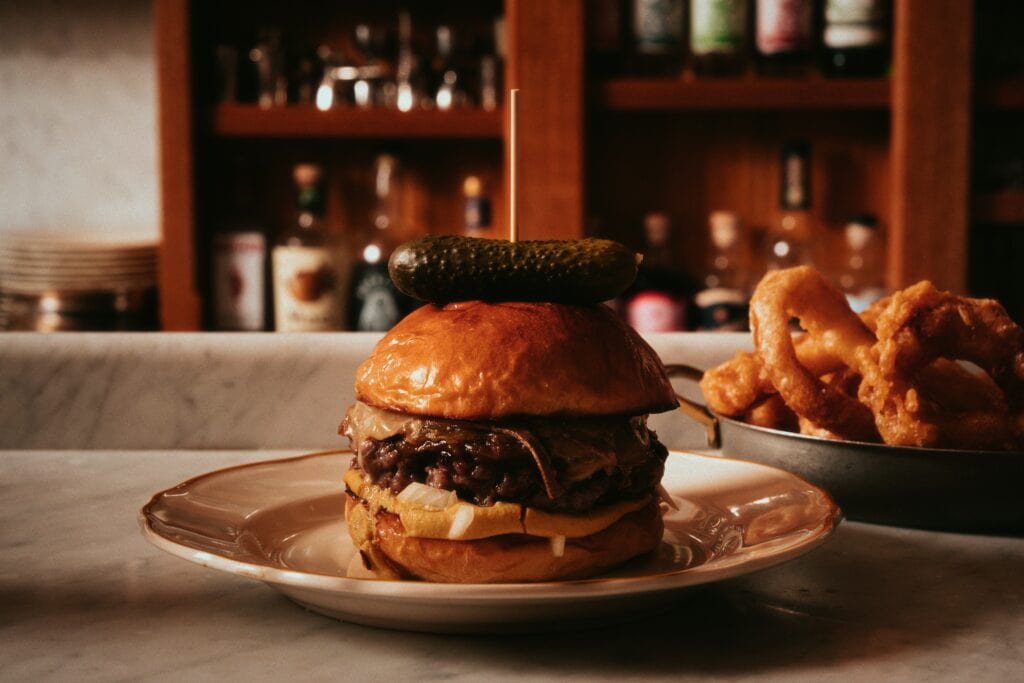 50/50 burger with onion rings at Joe's Tavern Newtown Sydney