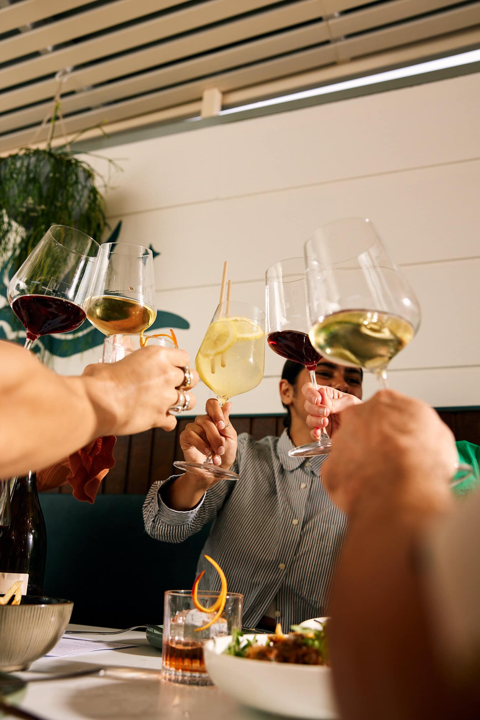 Wine glass cheers at Bar Lune in Adelaide.