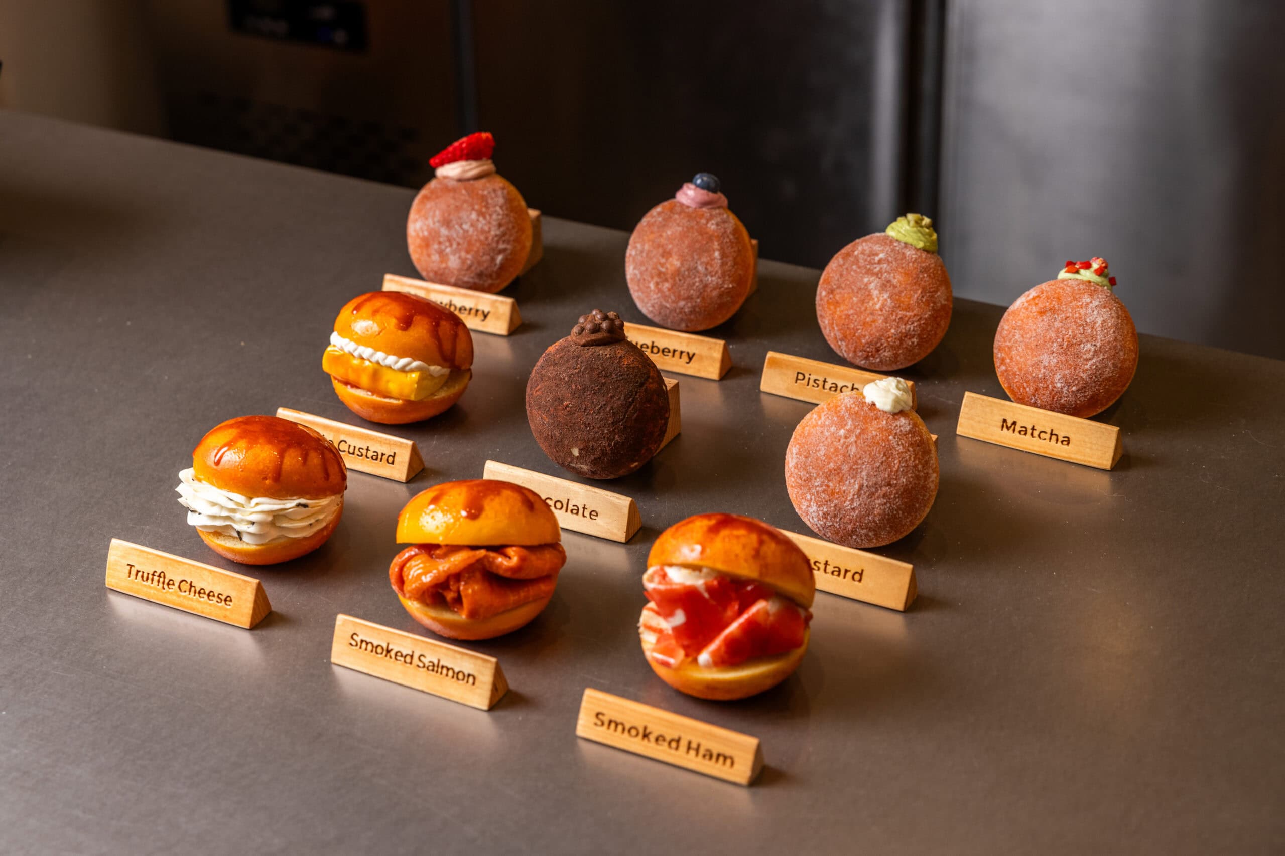 Japanese-inspired nama donuts in flavours including matcha, pistachio and blueberry alongside savoury smoked salmon and truffle cheese donuts at O'Donuts, Chatswood and Haymarket Sydney