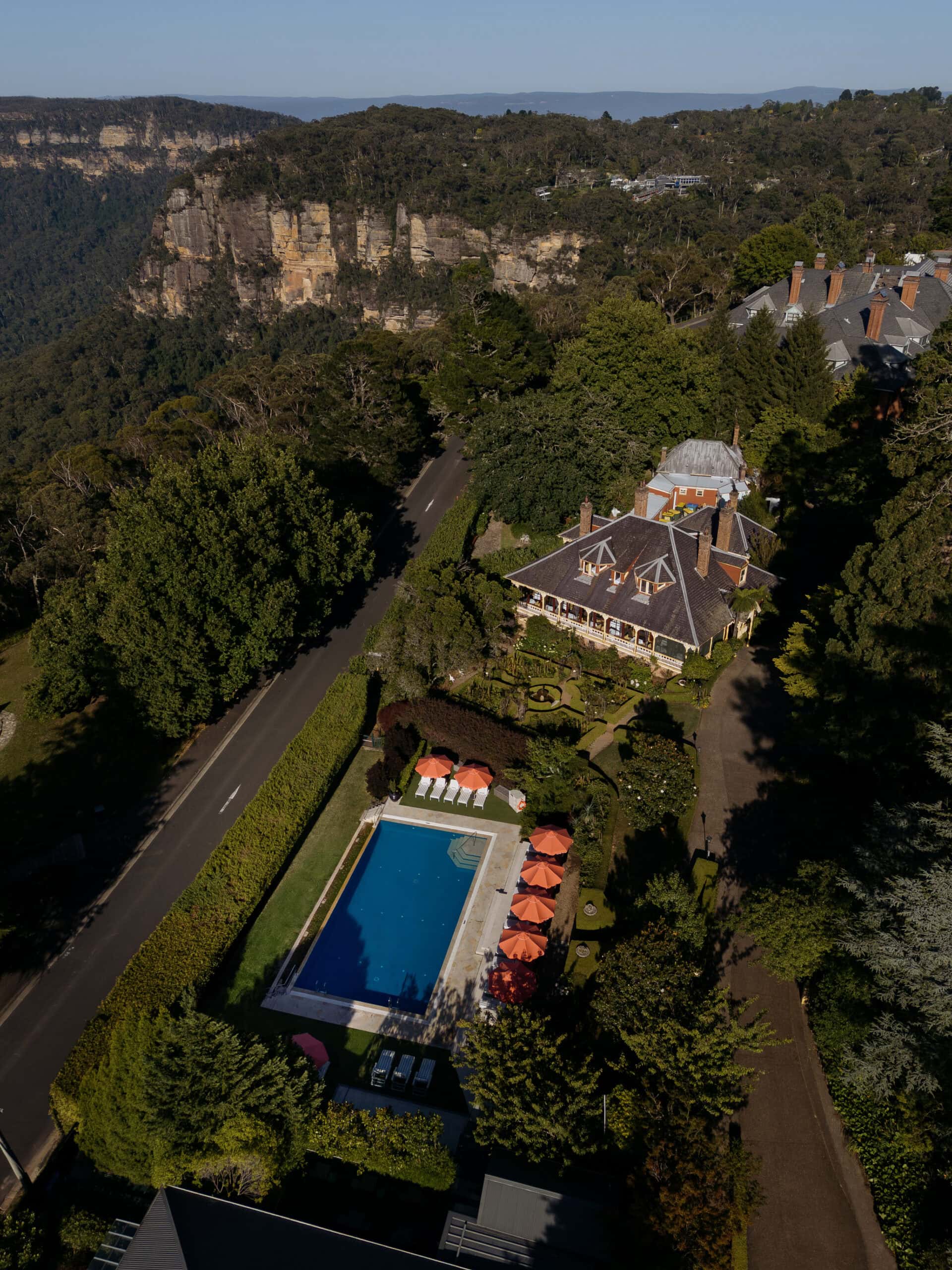 Aerial view of Ardour Lilianfels estate with outdoor pool and heritage gardens overlooking Jamison Valley Katoomba Blue Mountains