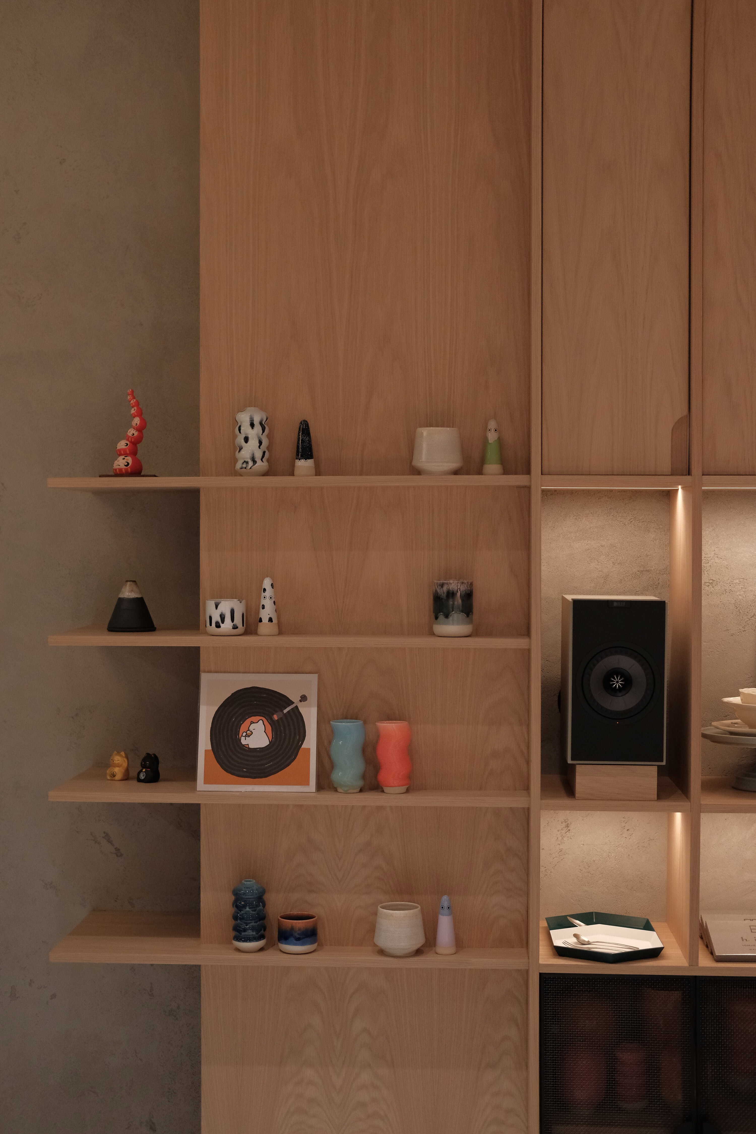 Ceramic homewares and vases displayed on timber shelving at Noom Rosebery Sydney