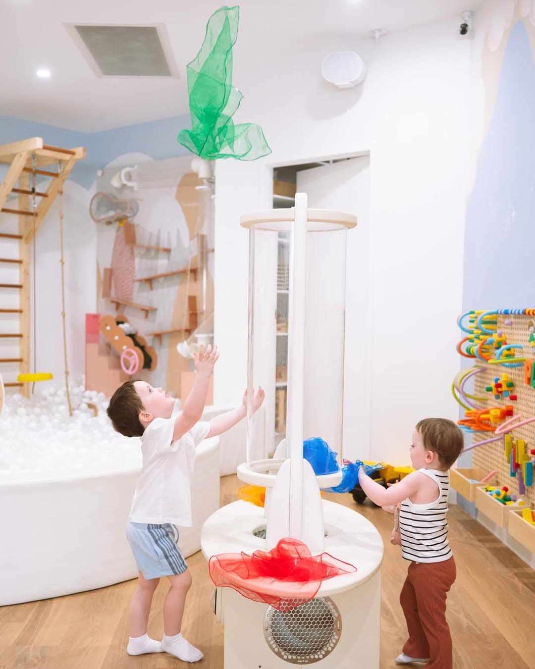 Children playing with butterfly nets at play maison in brisbane