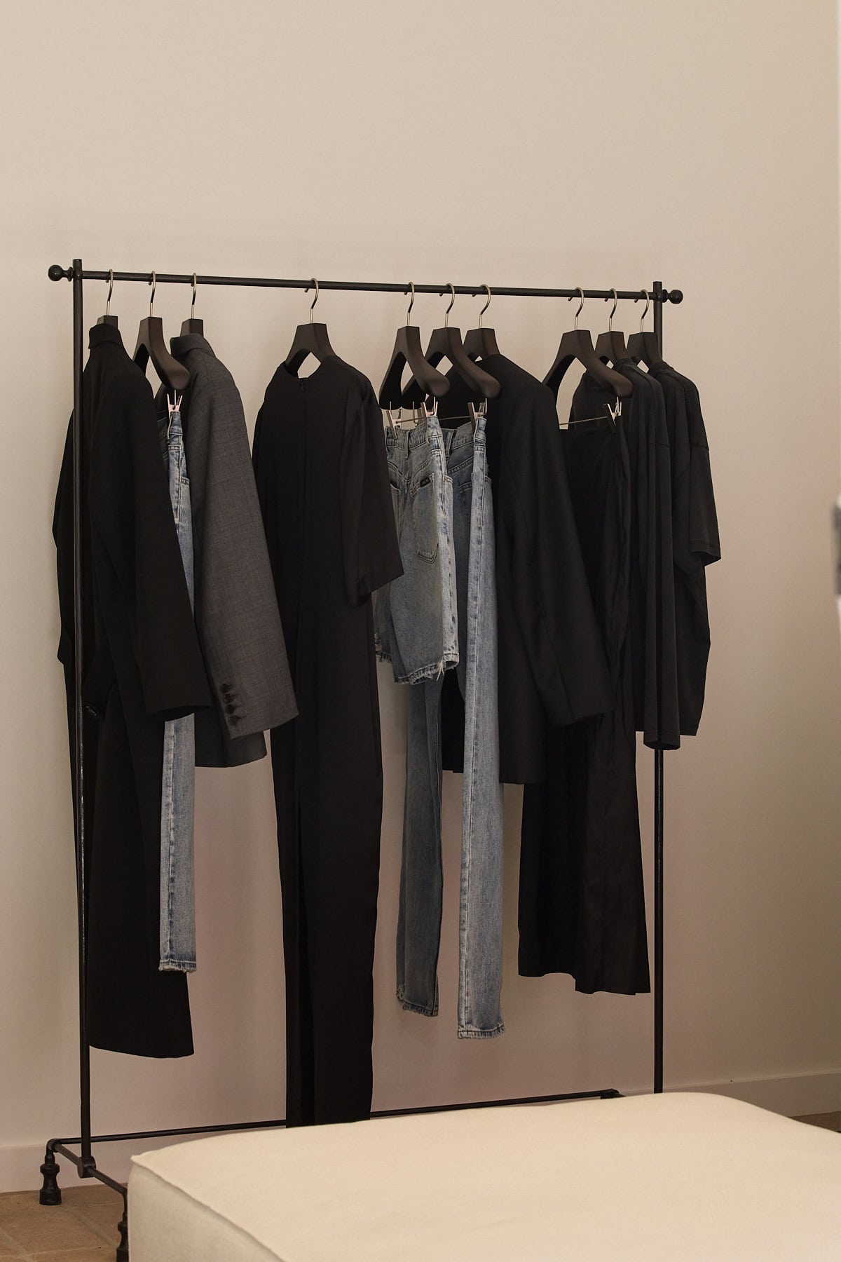 Minimalist black clothing rail with dark tailoring and denim Beare Park Paddington Sydney