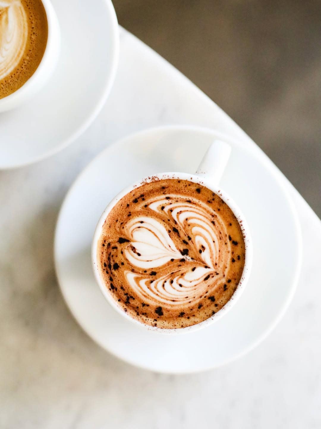 A coffee with latte art at harrys in Bondi