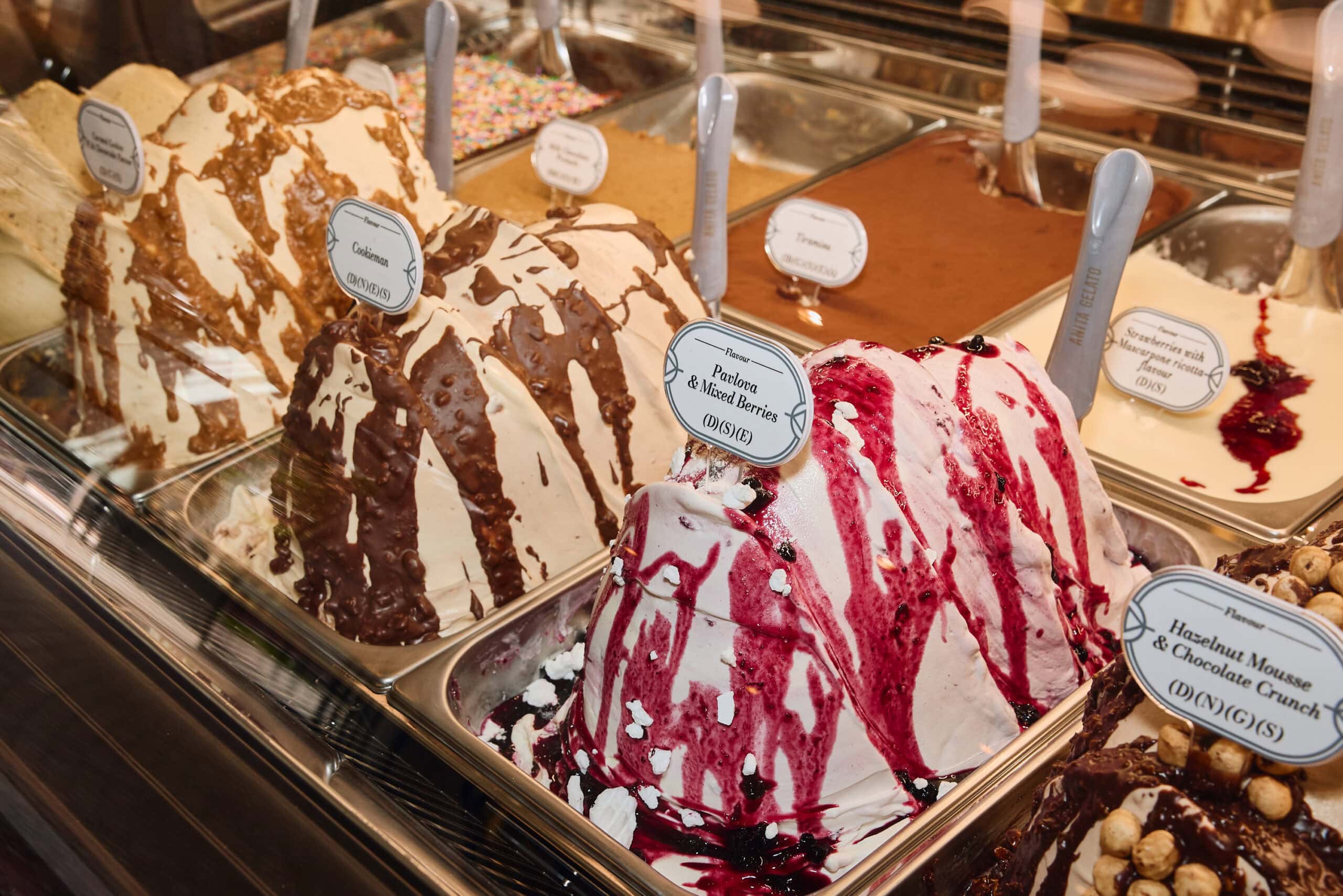 Cookieman, pavlova and mixed berries, and hazelnut mousse and chocolate crunch gelato display at Anita Gelato Victoria Cross North Sydney