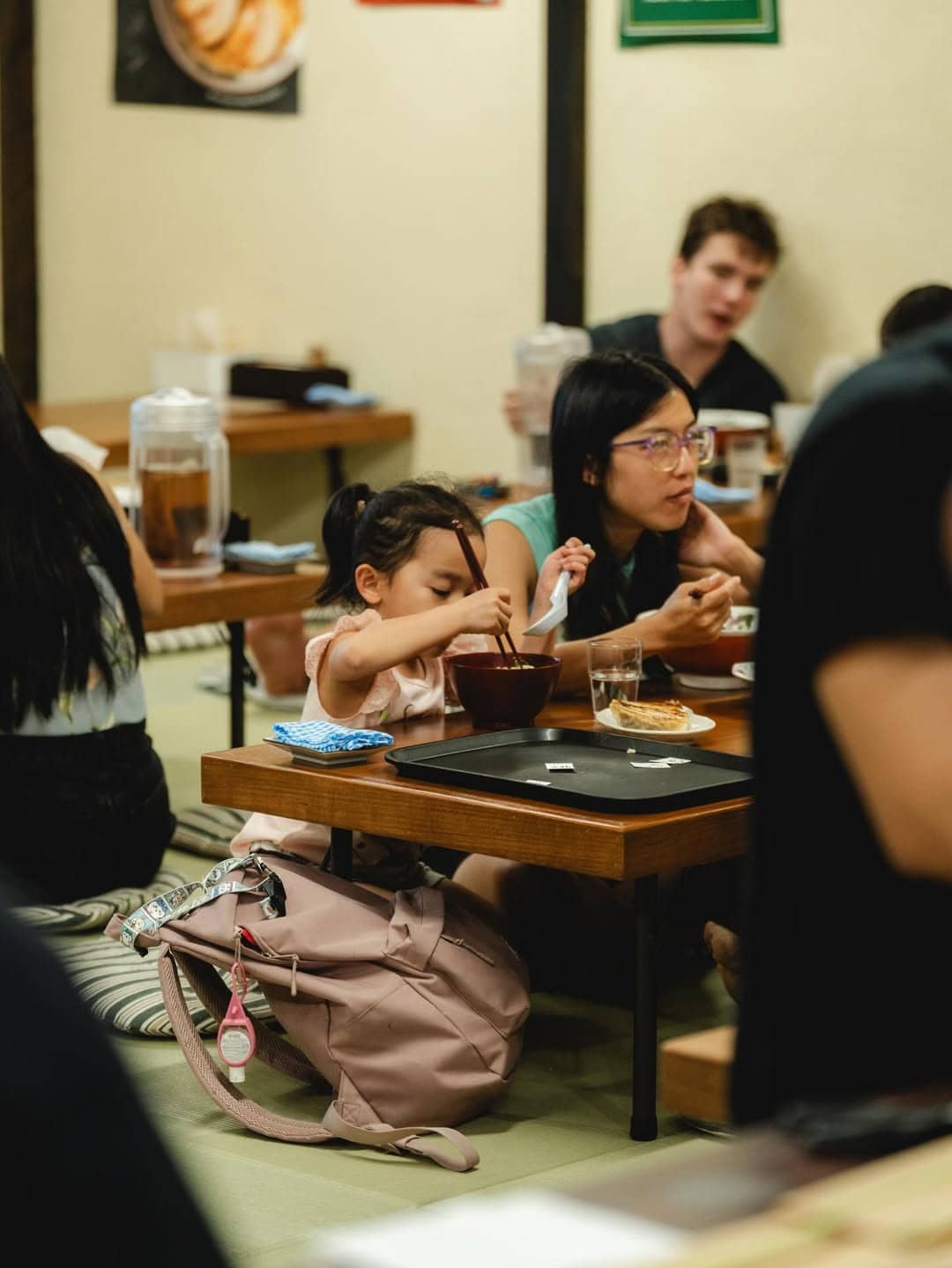 Diners seated at low tatami tables eating ramen Ramen Auru Crows Nest Sydney