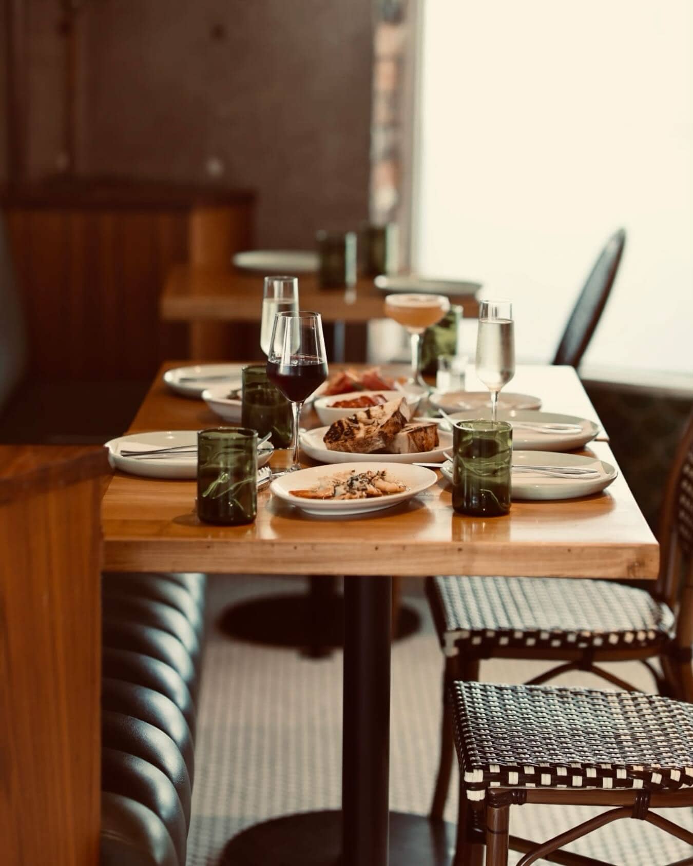 One of the indoor tables at Botellon set with tapas, wine and cocktails.