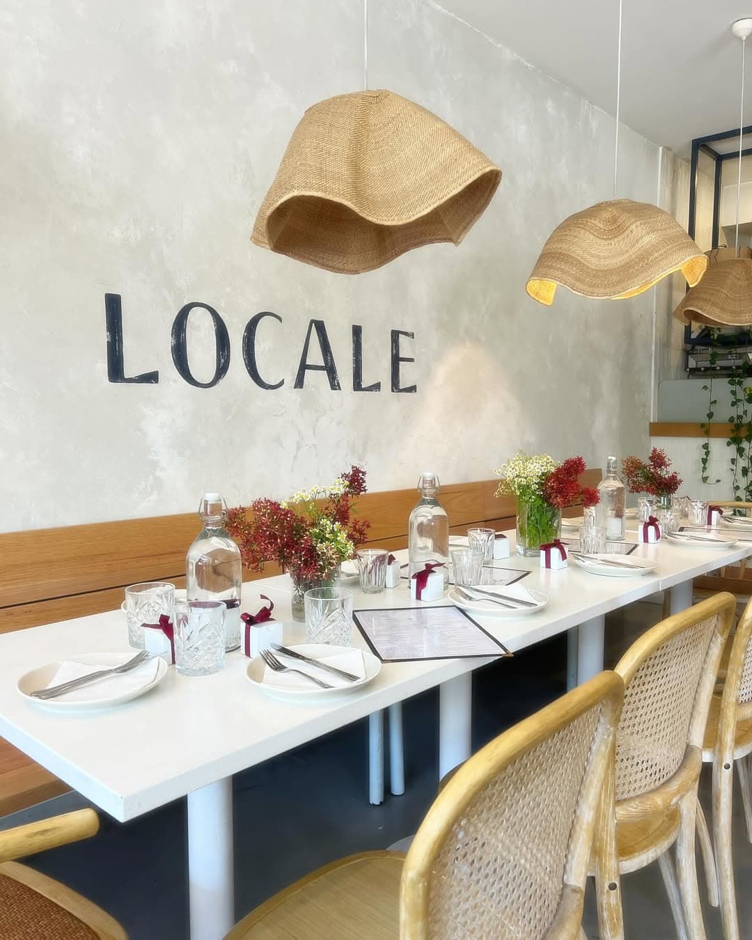 The neutral dining room with a table set up for an event at Locale in Bronte.