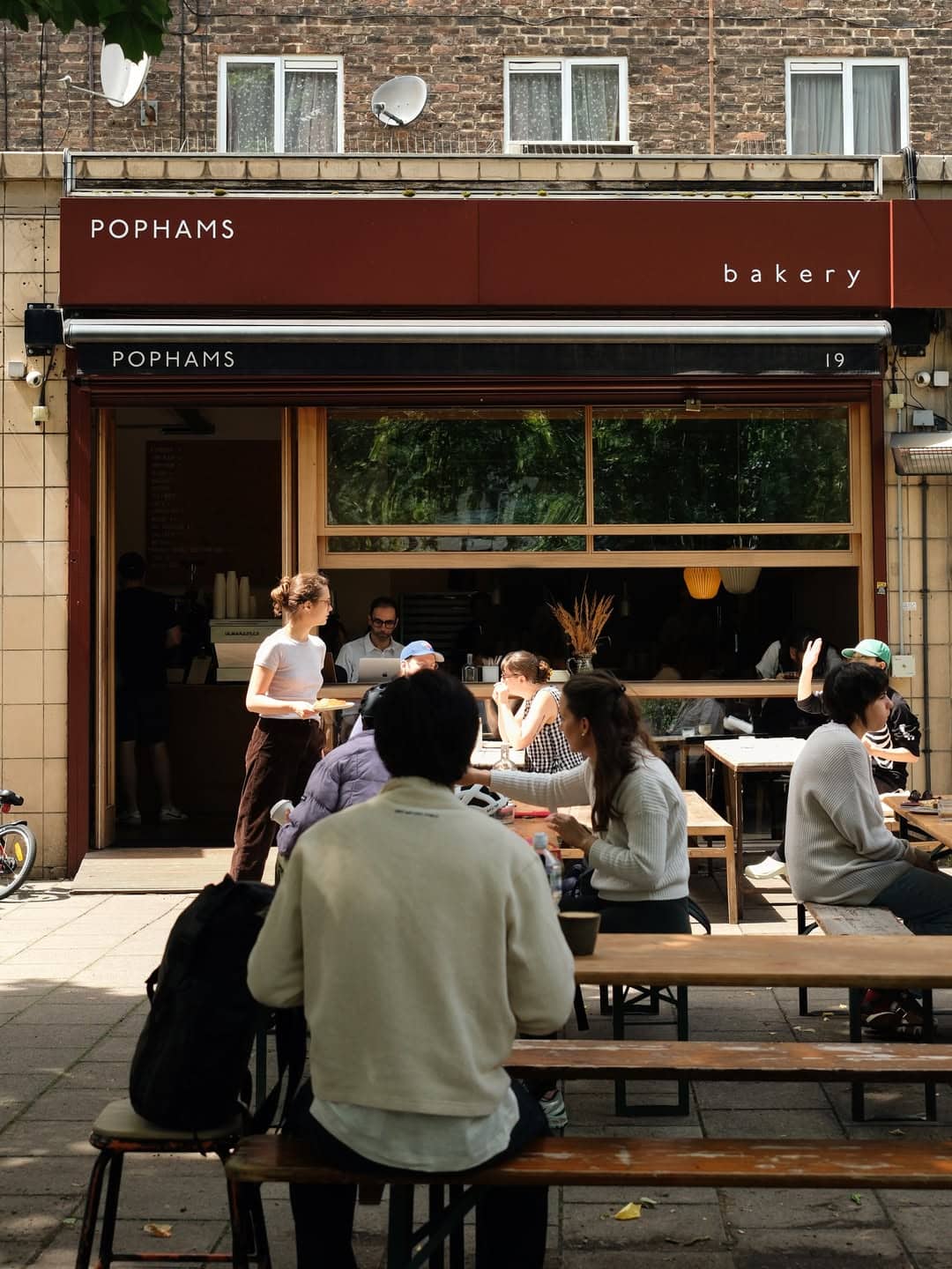 The outdoor benches out the front of Pophams bakery in London.