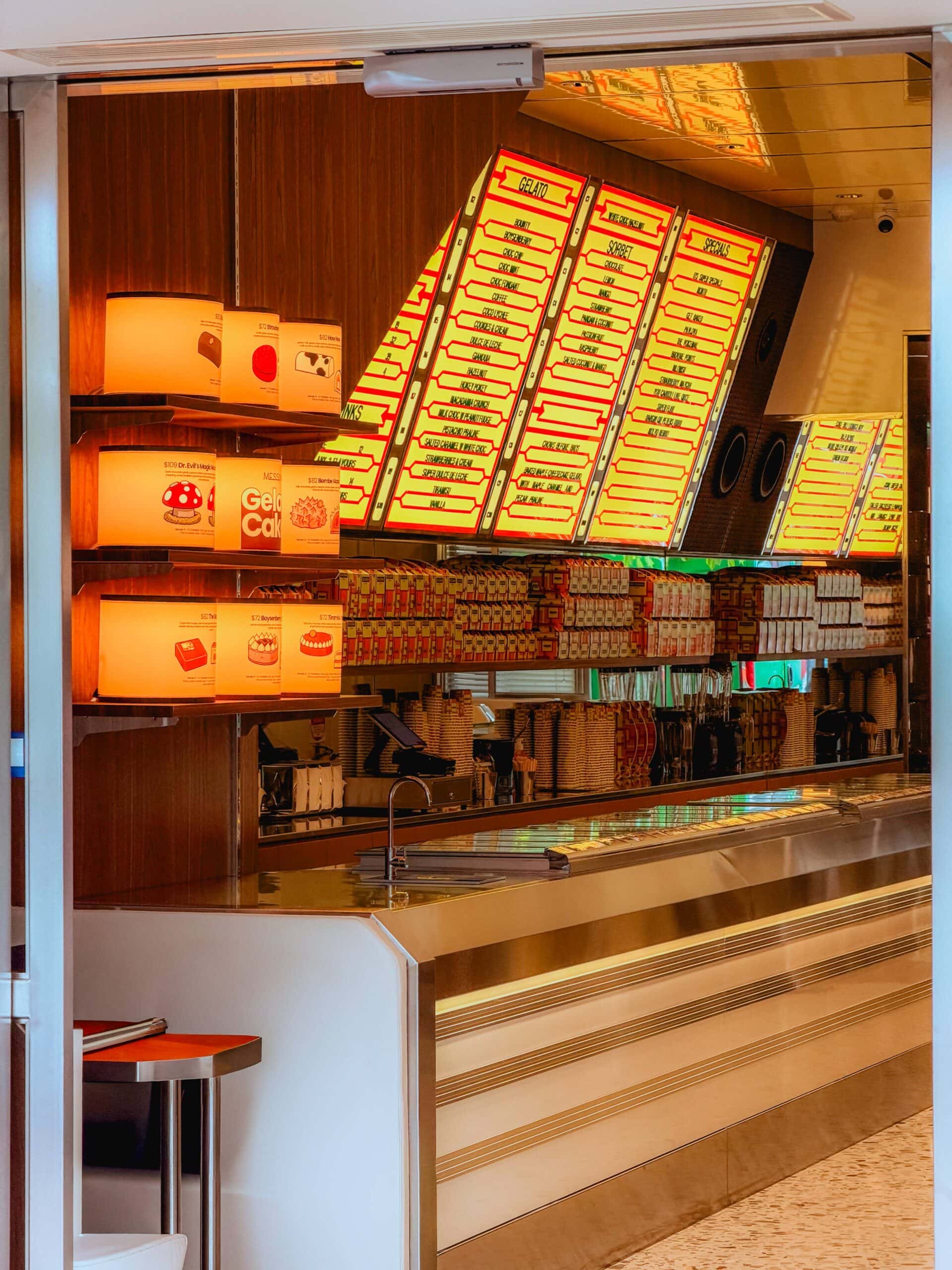 Gelato counter with illuminated jukebox-style menu board and cake display Messina Crows Nest Sydney