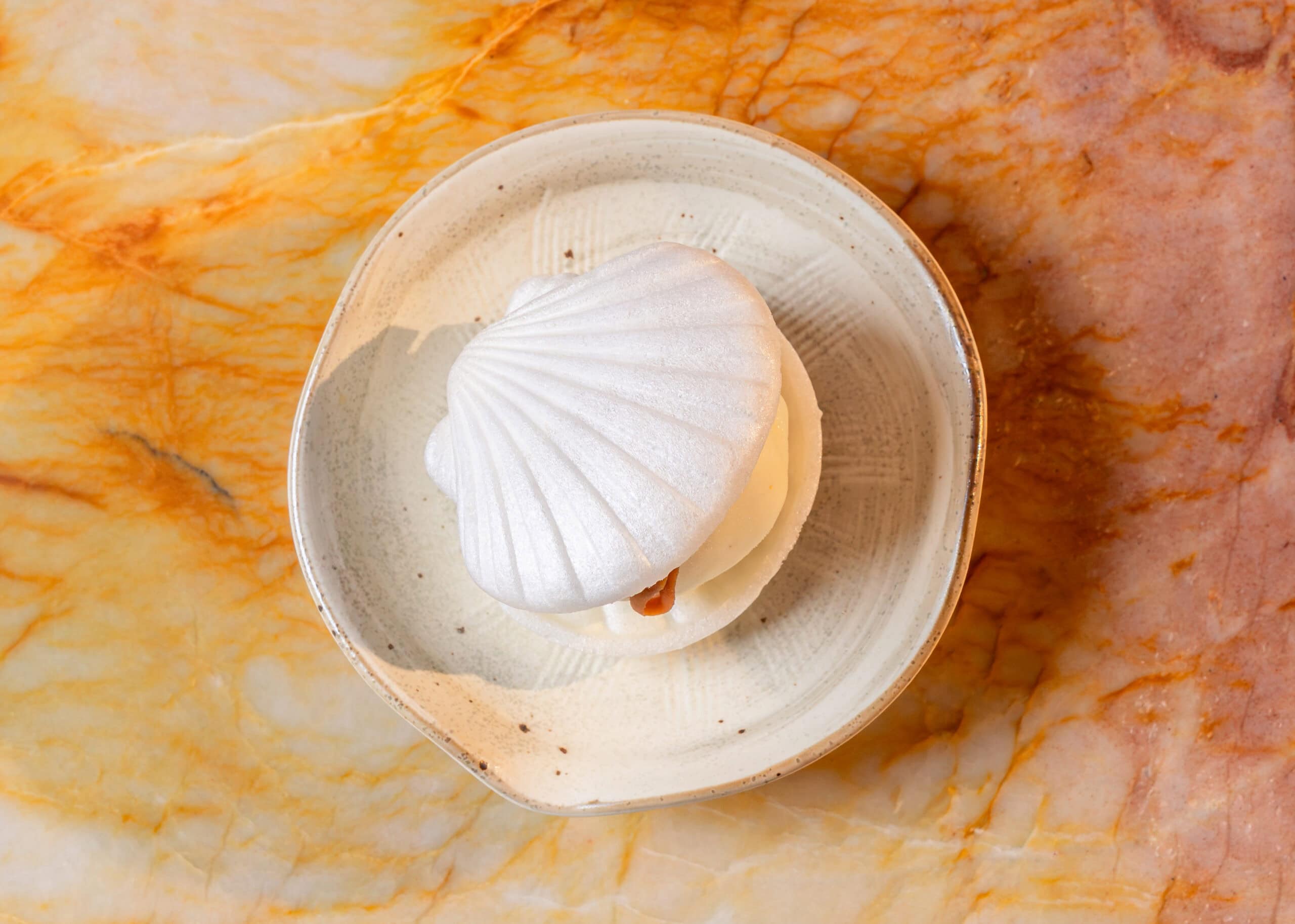 Hojicha and vanilla ice cream sandwich shell-shaped dessert on ceramic plate Fishnets Bronte Sydney
