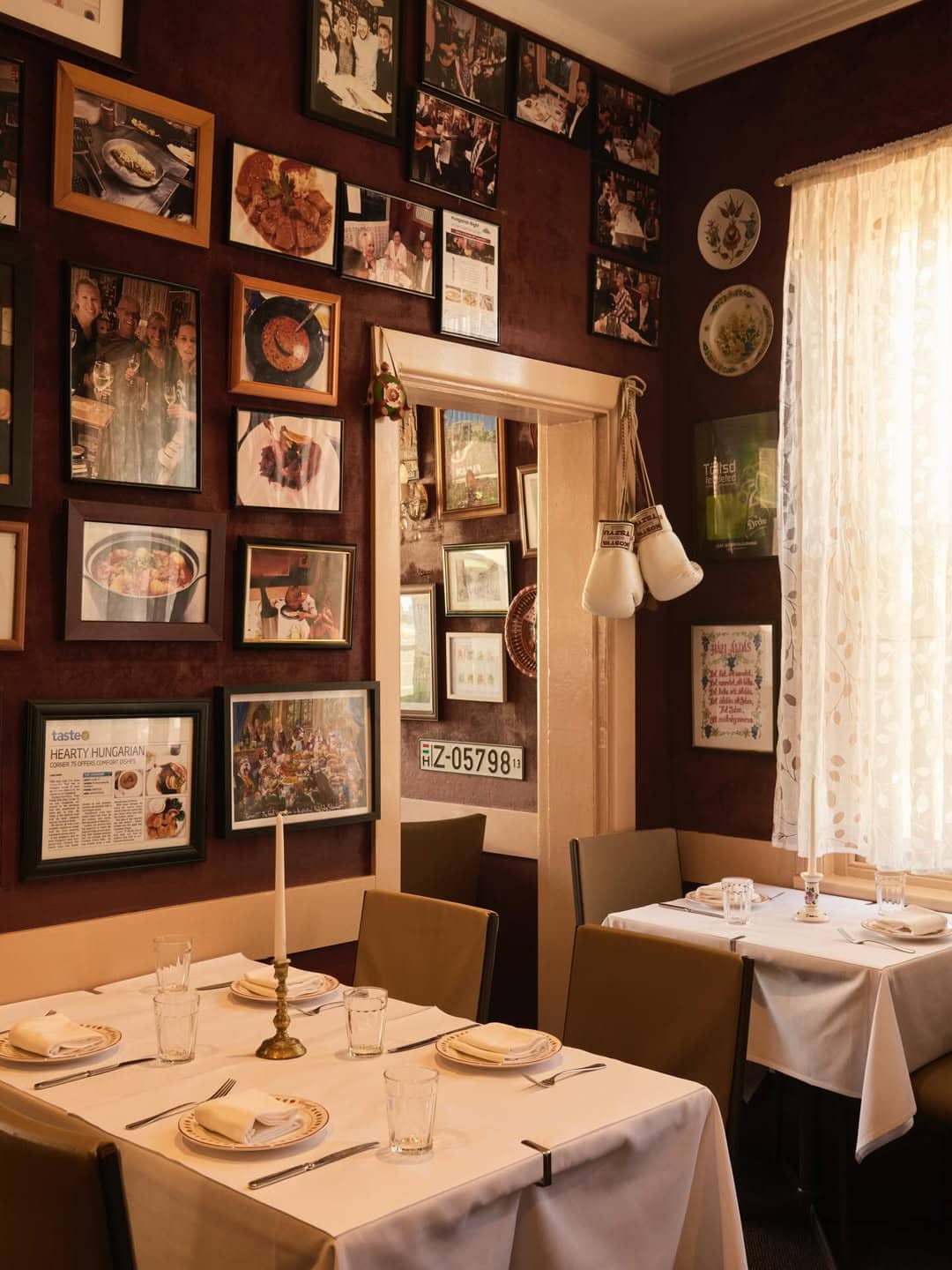 The maximalist and homely interiors of Corner 75's dining room in Randwick.
