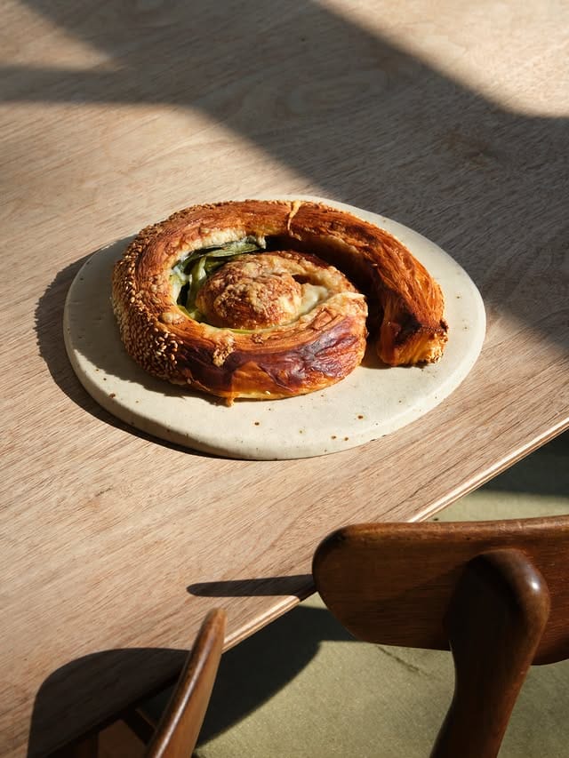 The marmite scroll in some early morning light at pophams bakery in london.