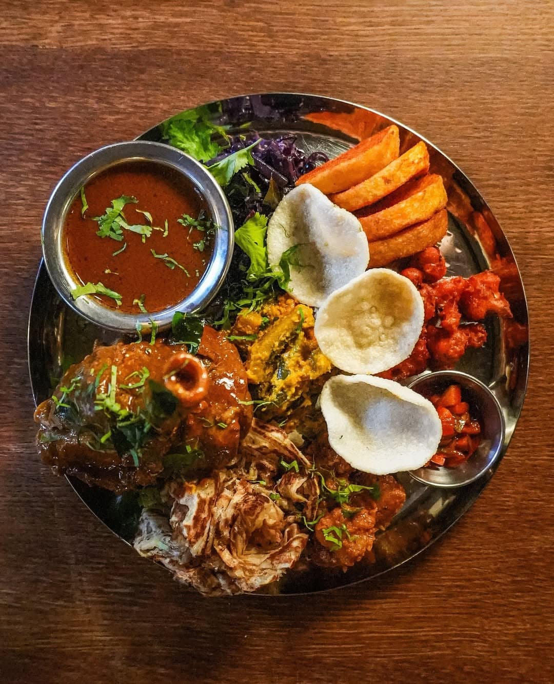 The masala roast, featuring naan, swwet potato, papadums and more from The Tamil Crown in Angel.
