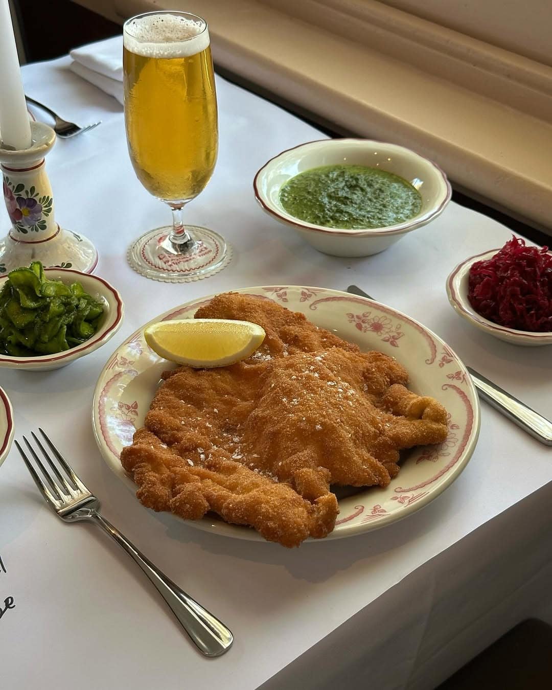 A plate-sized schnitzel and beer at Hungarain restaurant Corner 75 in Randwick.