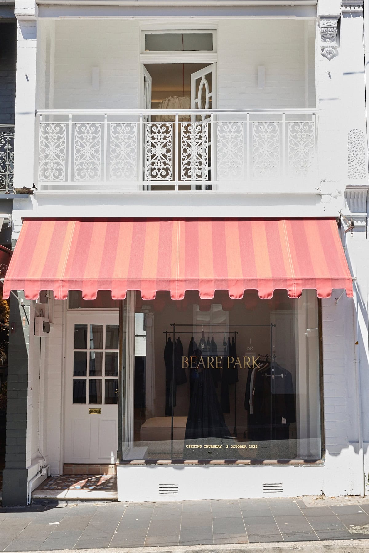 Store front with pink striped awning and gold signage Beare Park Williams Street Paddington Sydney