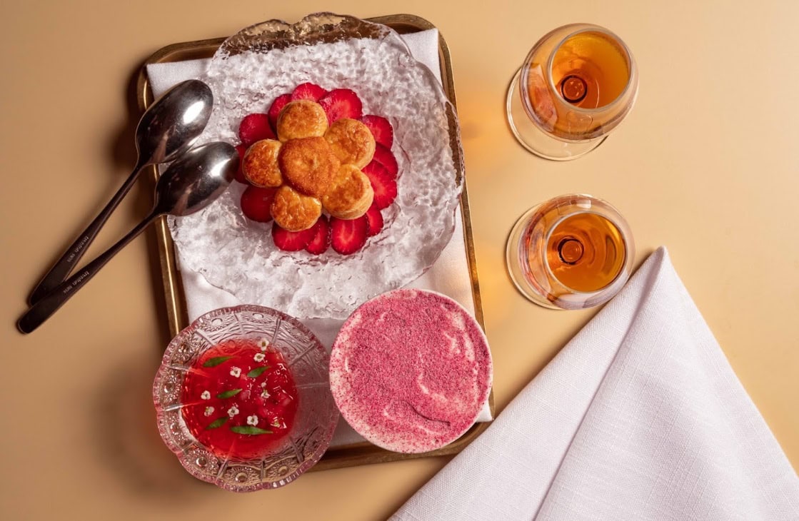Strawberry choux pastry dessert with sorbet and glasses of rosé at The Heritage Room Martin Place Sydney