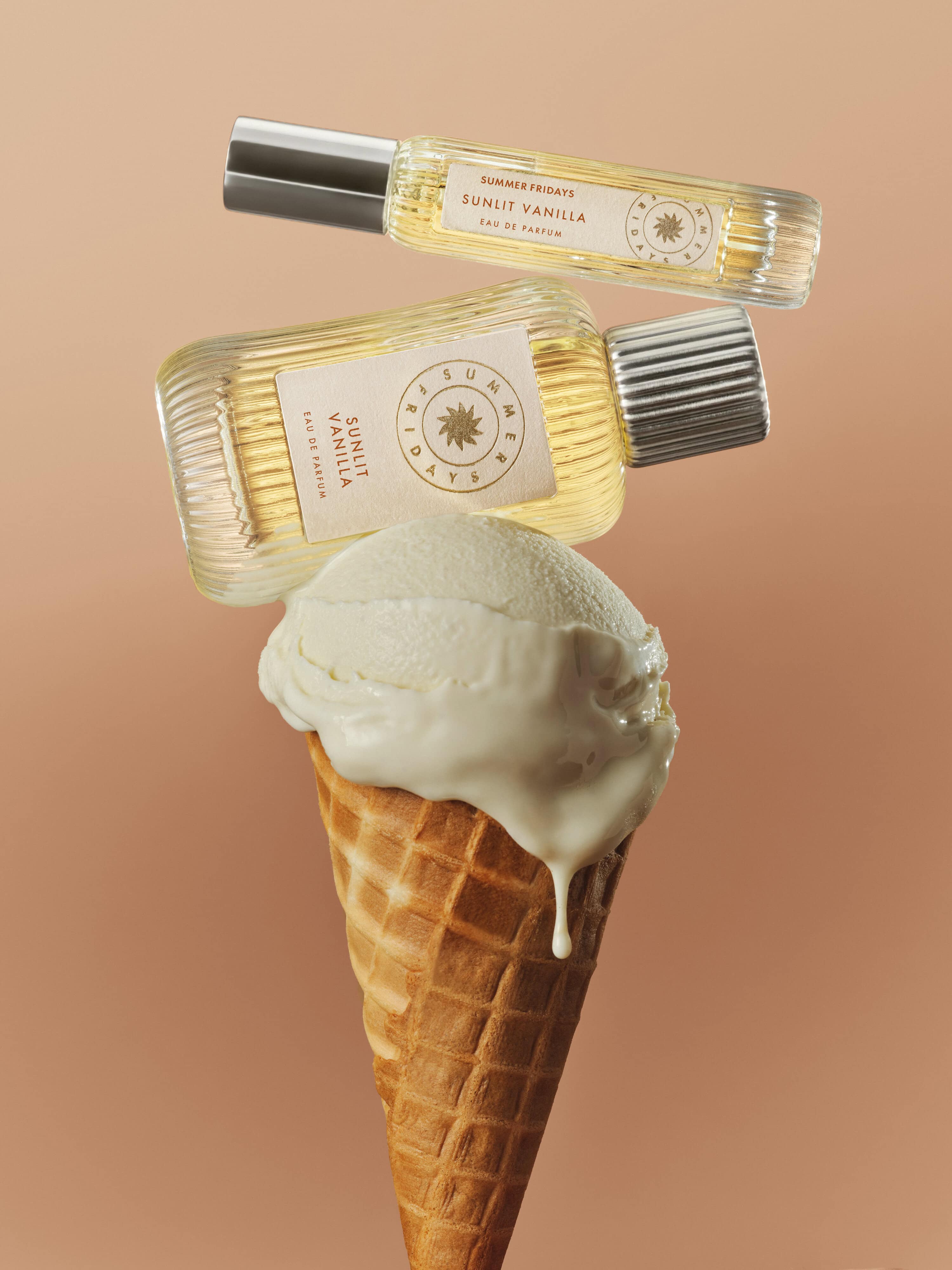 Summer Fridays Sunlit Vanilla EDP fragrance bottle styled with ice cream cone product