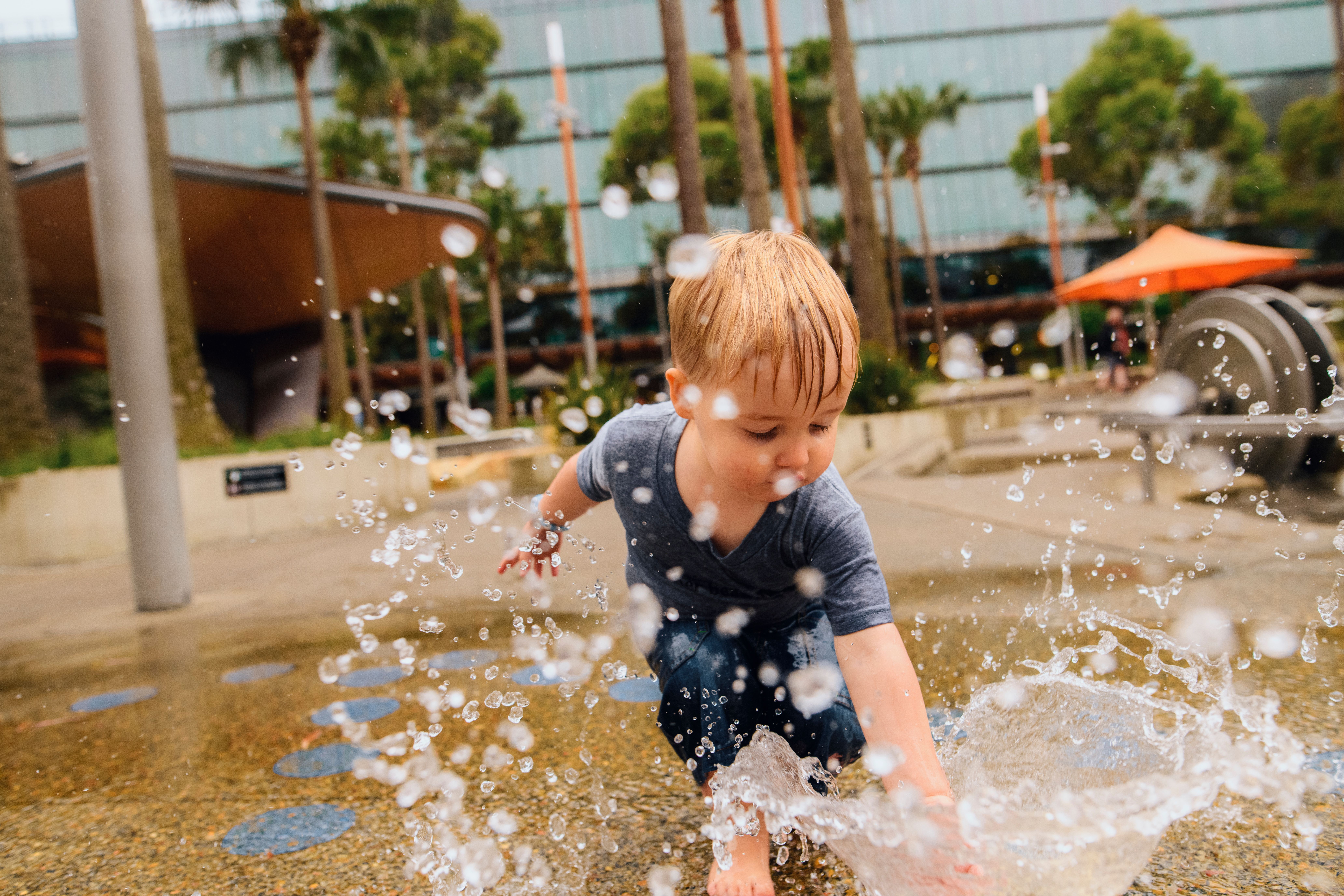 Young boy having a fun day out at The Playground, Darling Quarter in Darling