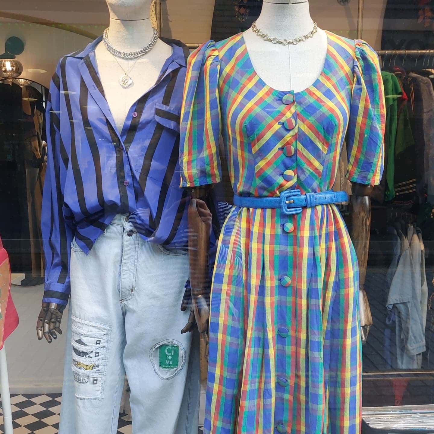 Two mannequins dressed in vintage in the window of Inca Vintage at Camden Passage in Angel.