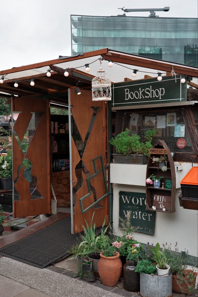 The entrance to the canal boat bookshop word on the water.