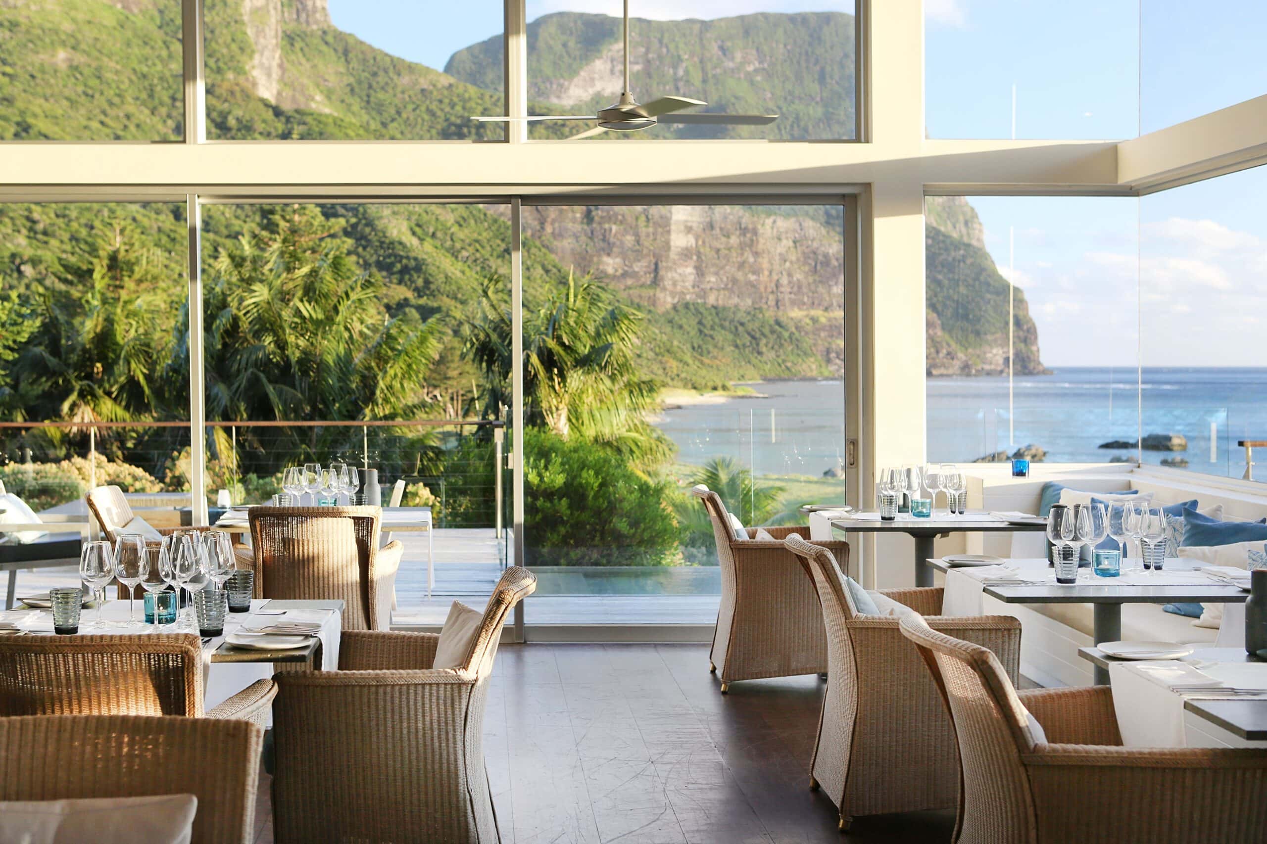 Dining area with scenic coastal views of Mount Gower. Capella Lodge, Lord Howe Island.