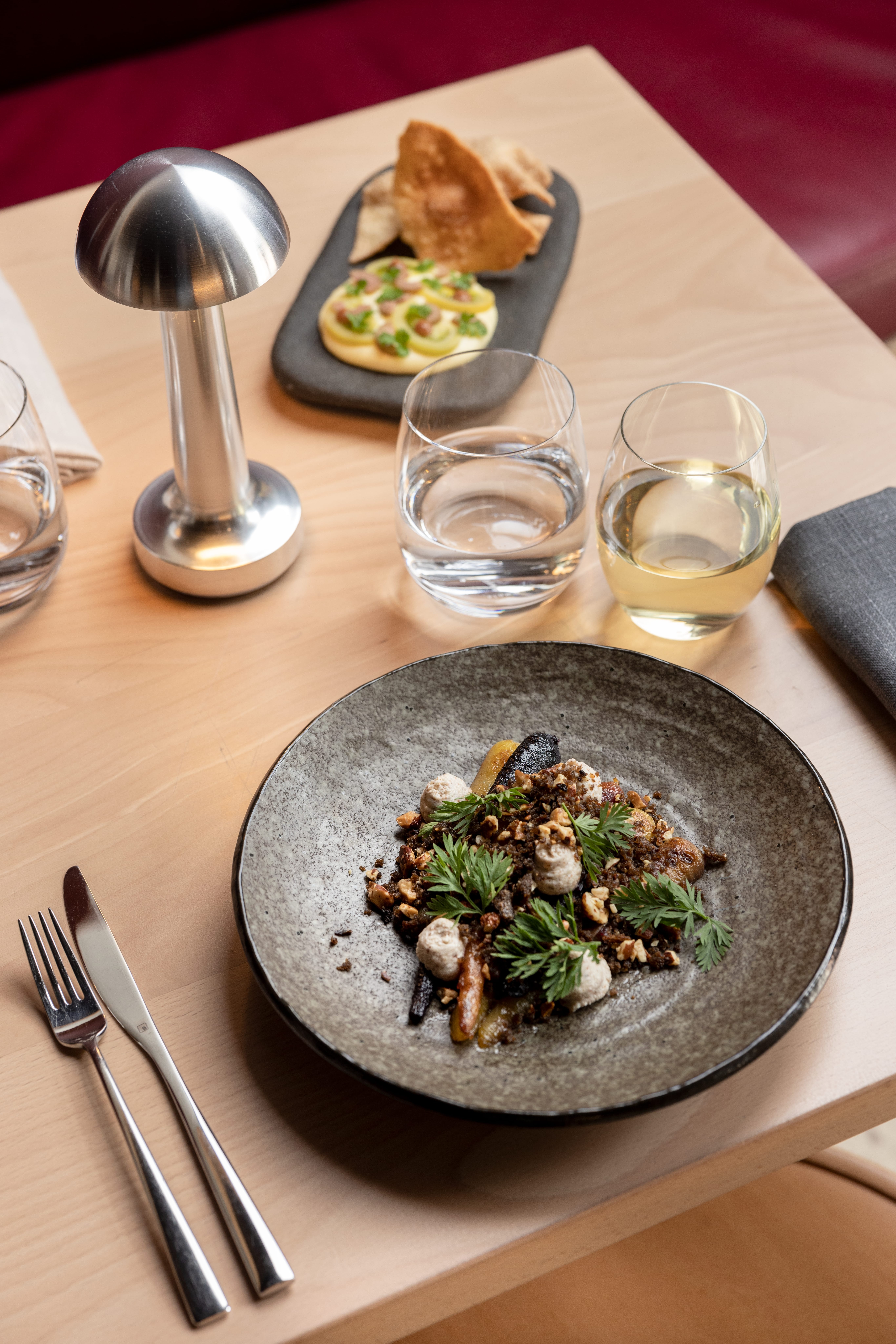 Dishes and drinks on table at Aurora in Adelaide.