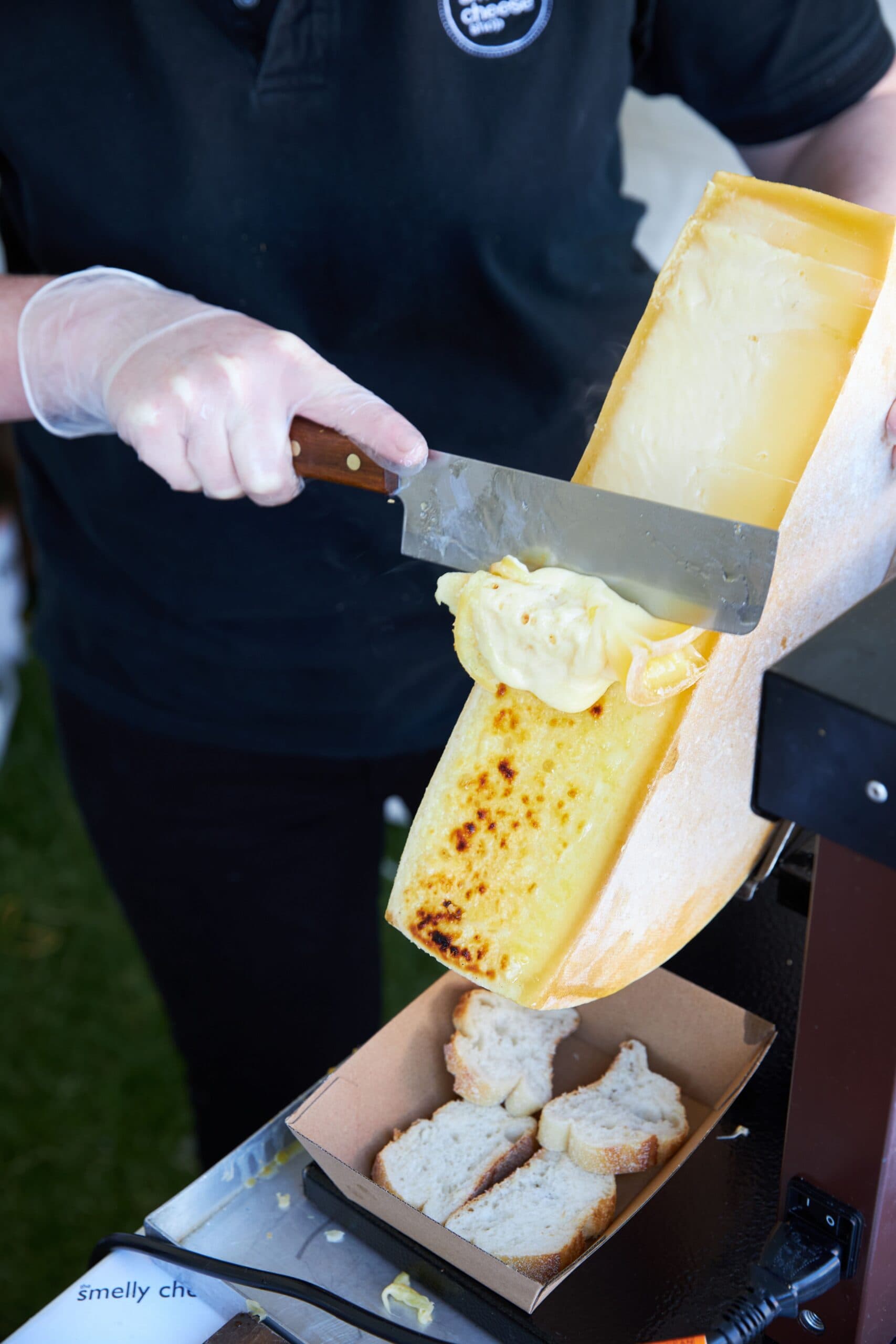 Scraping cheese at CheeseFest in Adelaide.