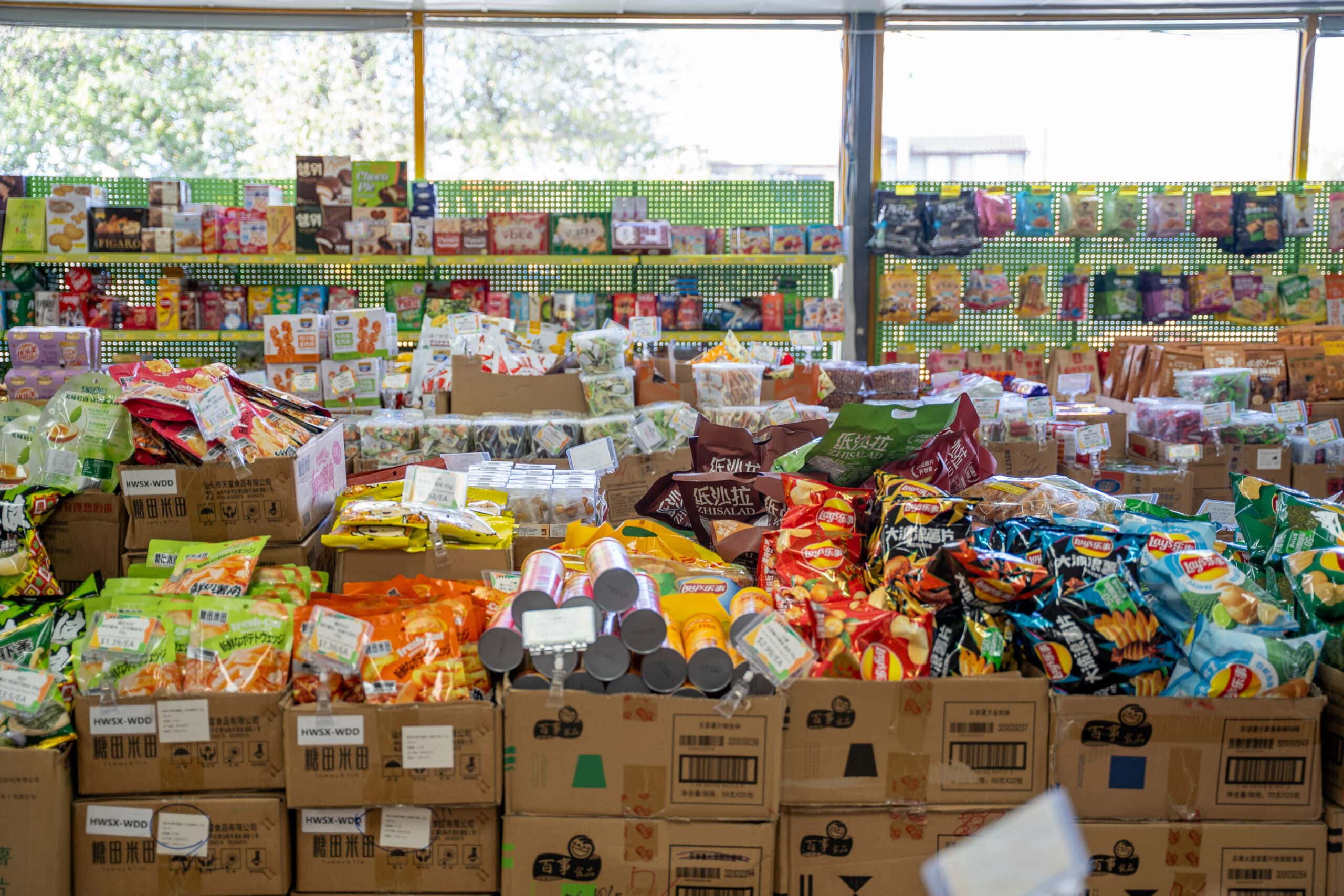 Display of imported snacks and grocery products inside Mr Dodo Wholesale Supermarket.