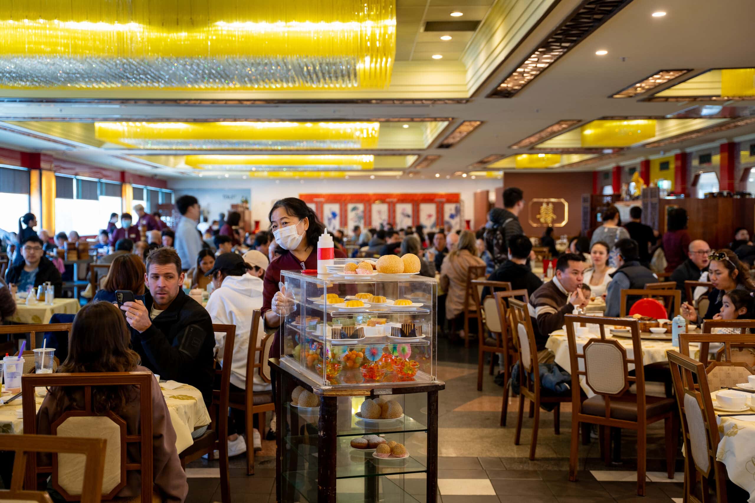 Busy dining room filled with guests enjoying yum cha at Gold Leaf Restaurant in Springvale.