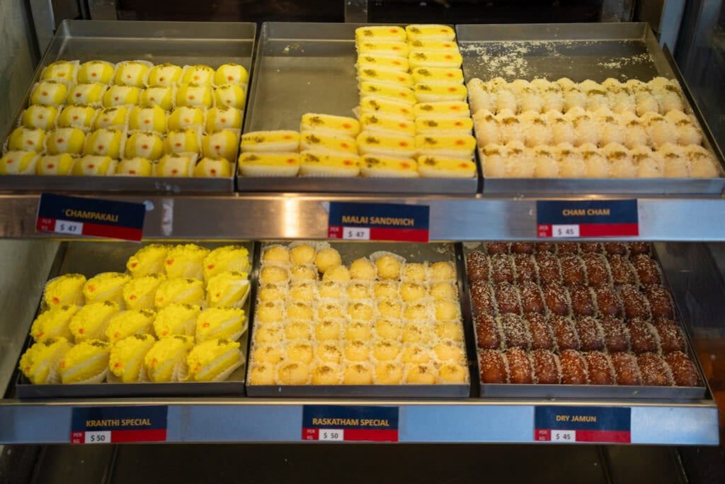 Trays of traditional Indian desserts on display at A2B Melbourne.