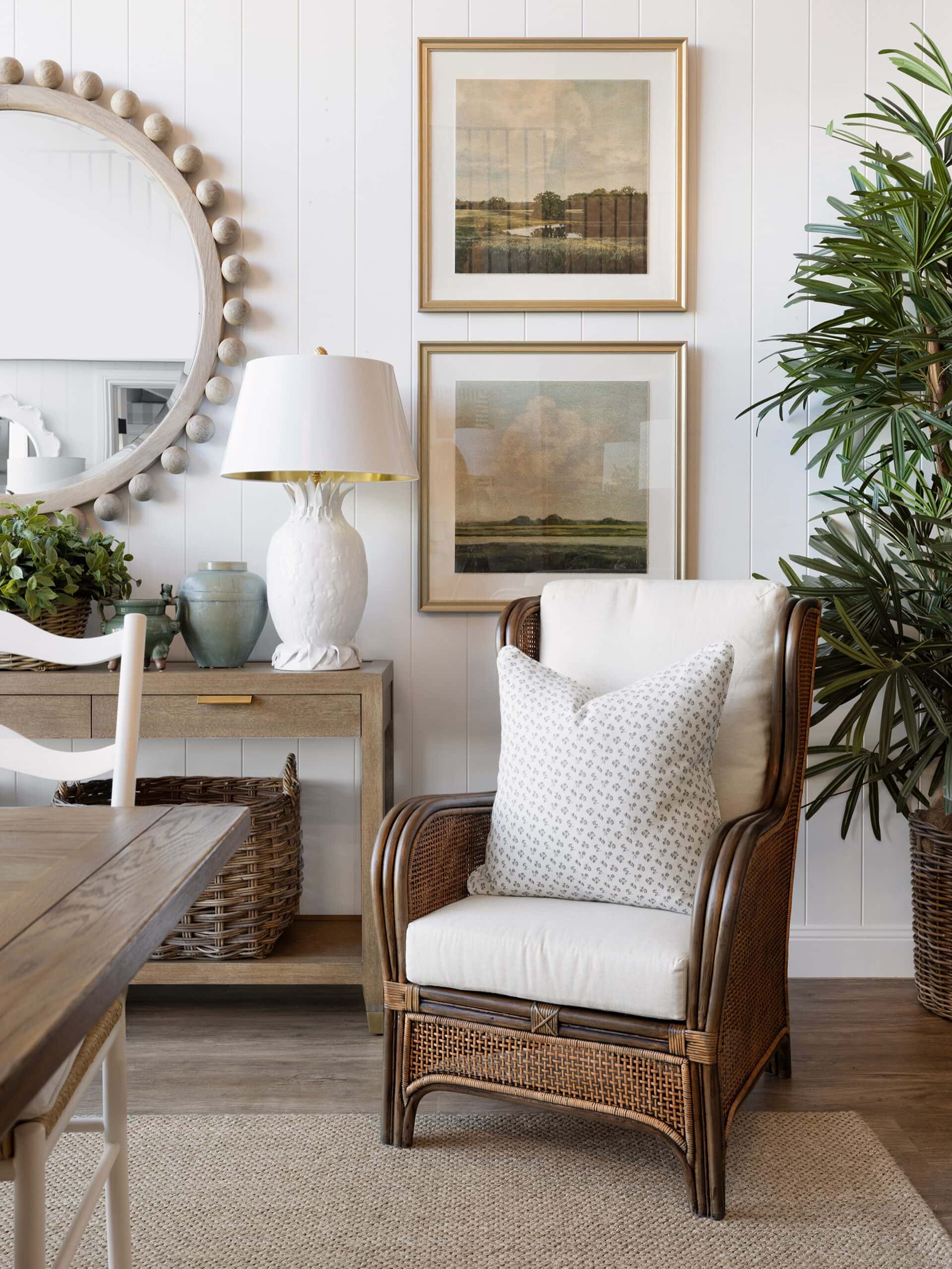 The Highgate House furniture showroom featuring a popular wooden armchair with cushions on top.