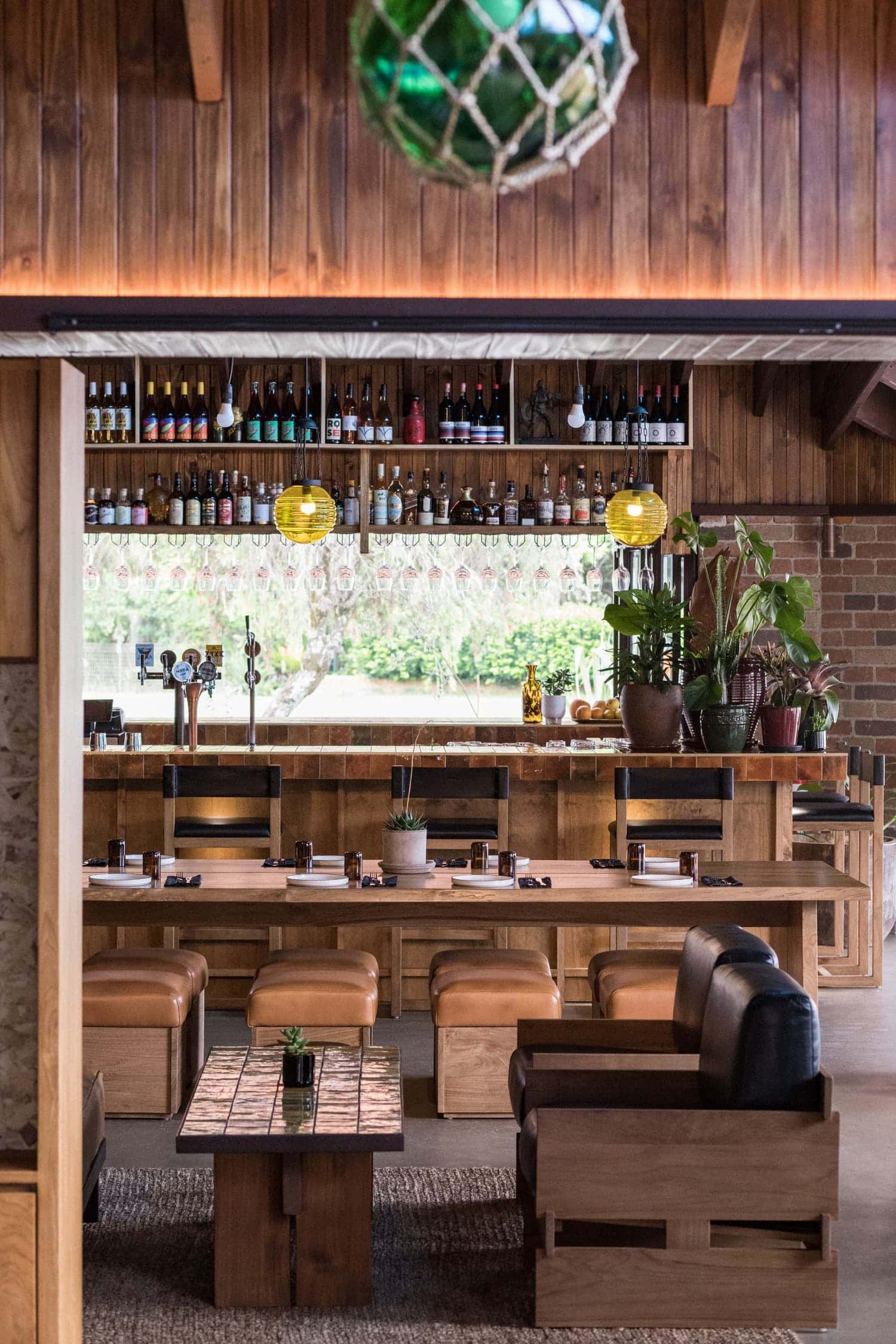Bar and dining interior with timber panelling and pendant lights at Sea Sea Hotel Crescent Head NSW