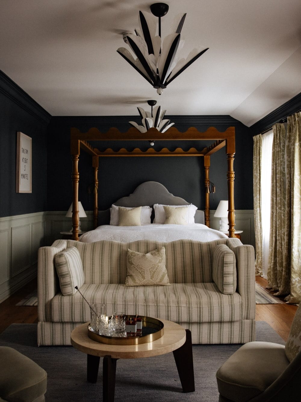 An elegant four-poster bed at Osborn House in Bundanoon.