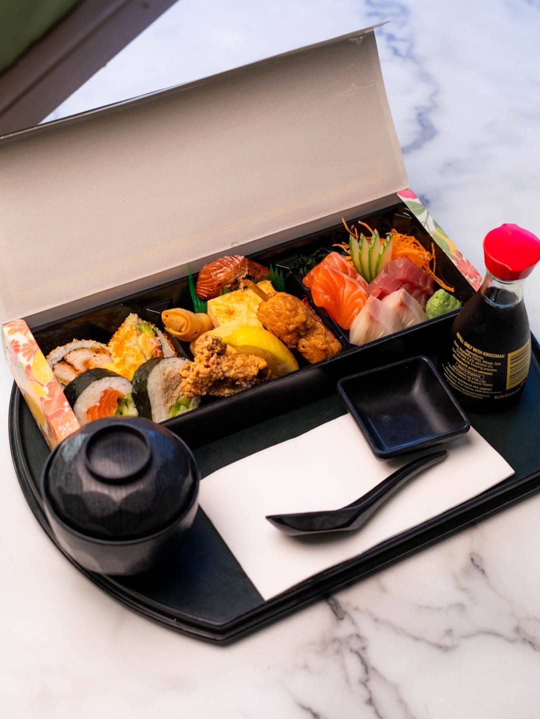 A selection of sashimi in a bento box at Reef in Brisbane.