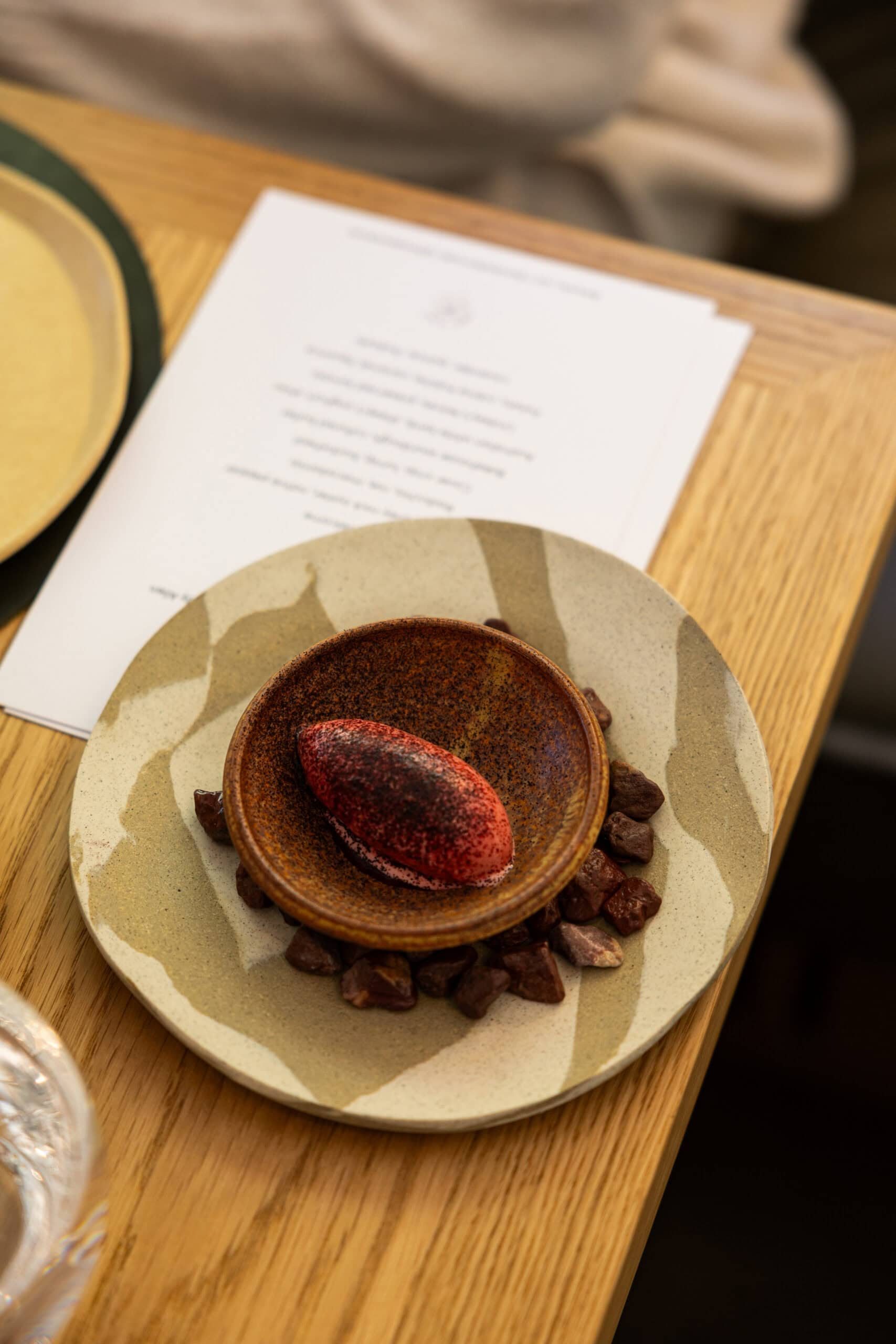 Artistic dessert plating with menu card at Three Blue Ducks Burradoo NSW