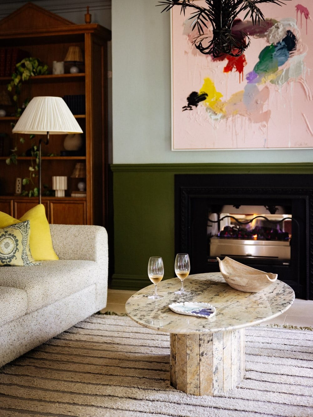 The mid-century interiors at Osborn House, featuring two welcome glasses of champagne.