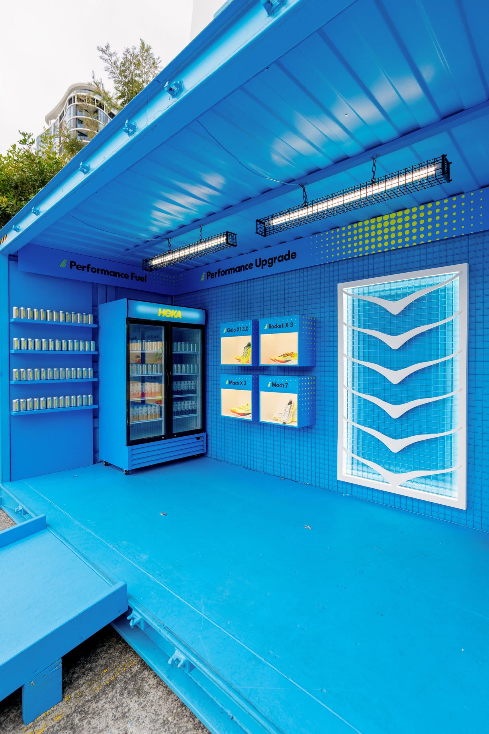 HOKA City2Surf Pit Stop with shoe displays and drinks fridge at Centennial Park Sydney