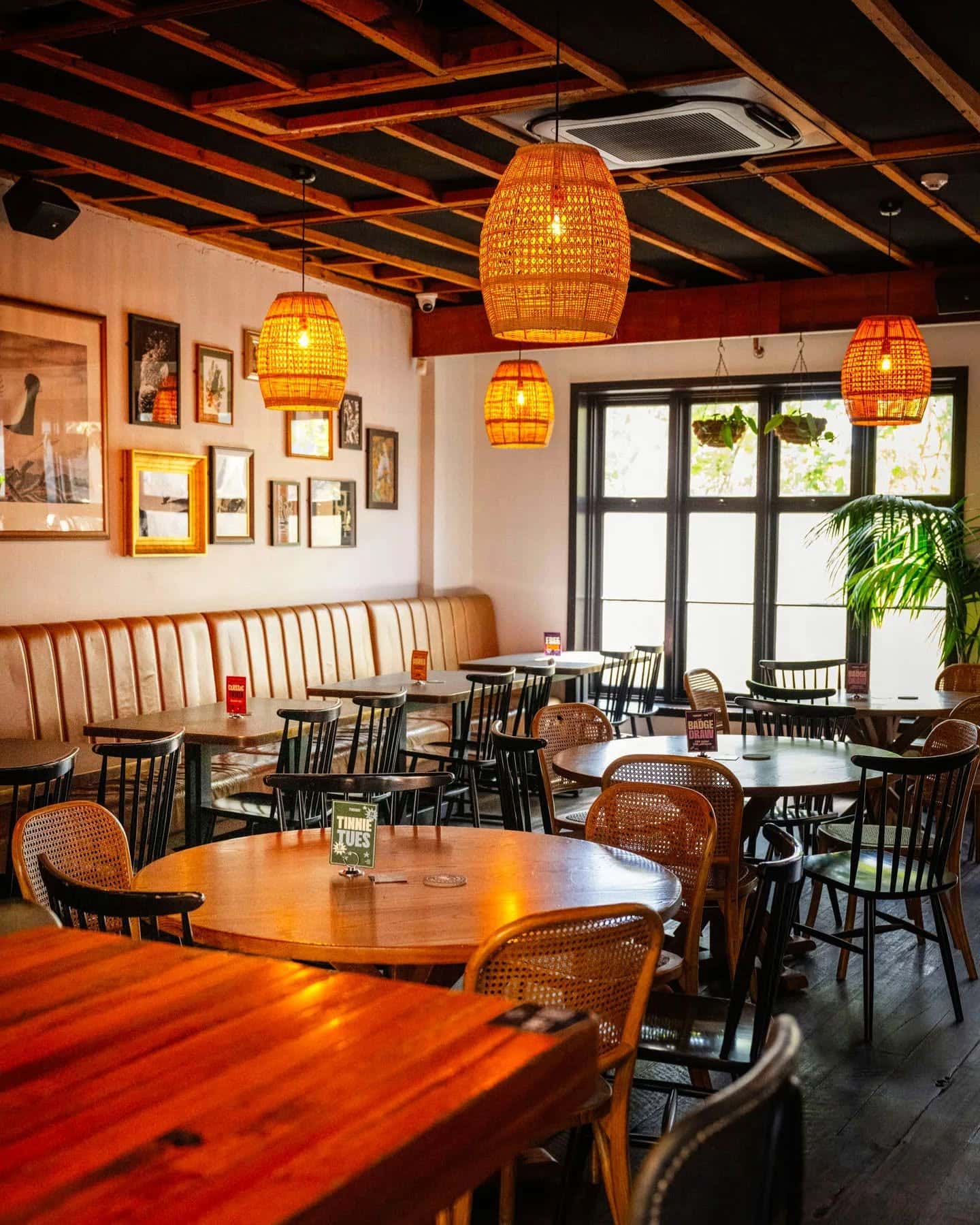 The dining room of the white cockatoo in petersham featuring pendant basket lights.