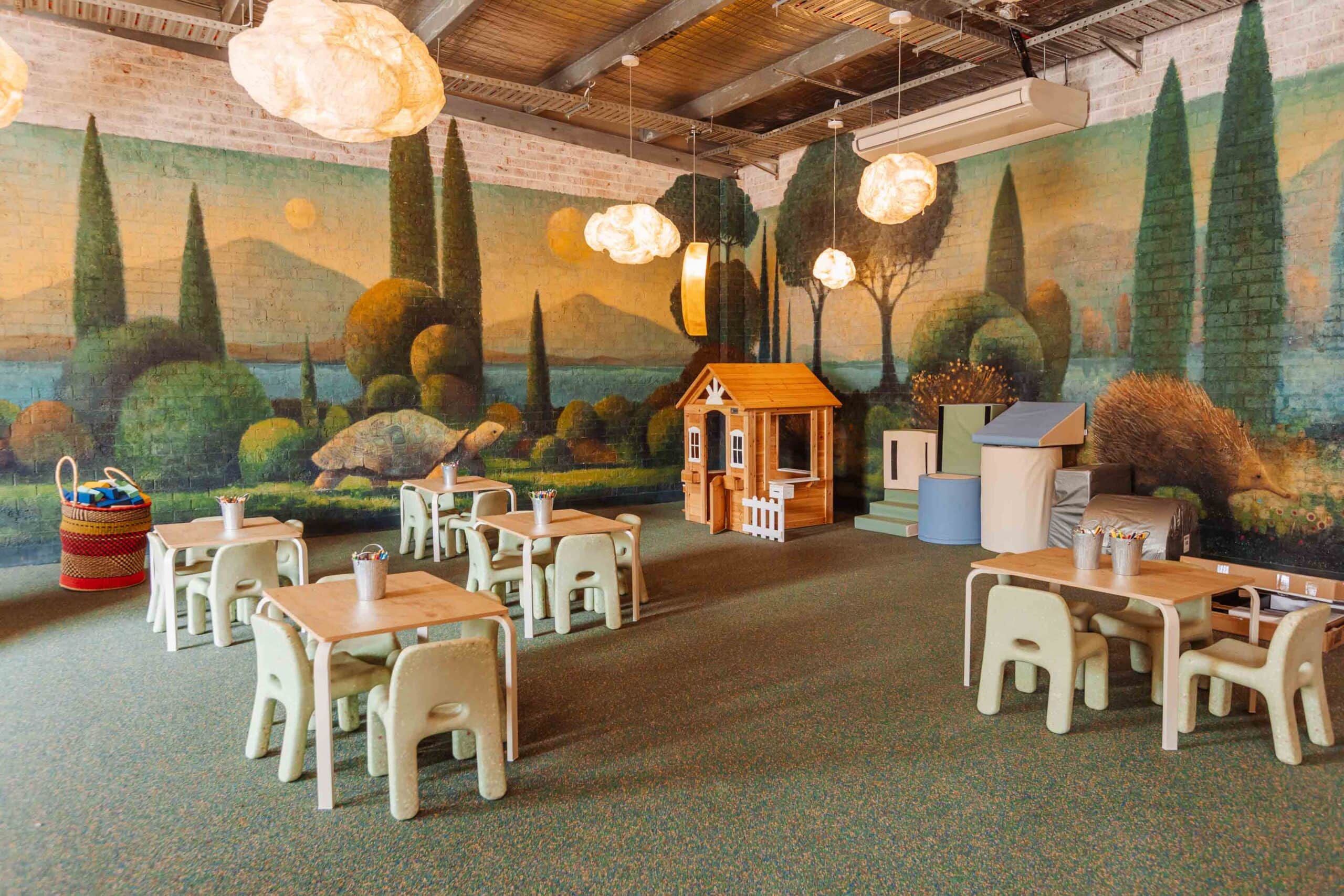kids-play-area-public-house-petersham-sydney.jpg Alt text: kids play area with mural and cubby house at Public House Petersham Sydney