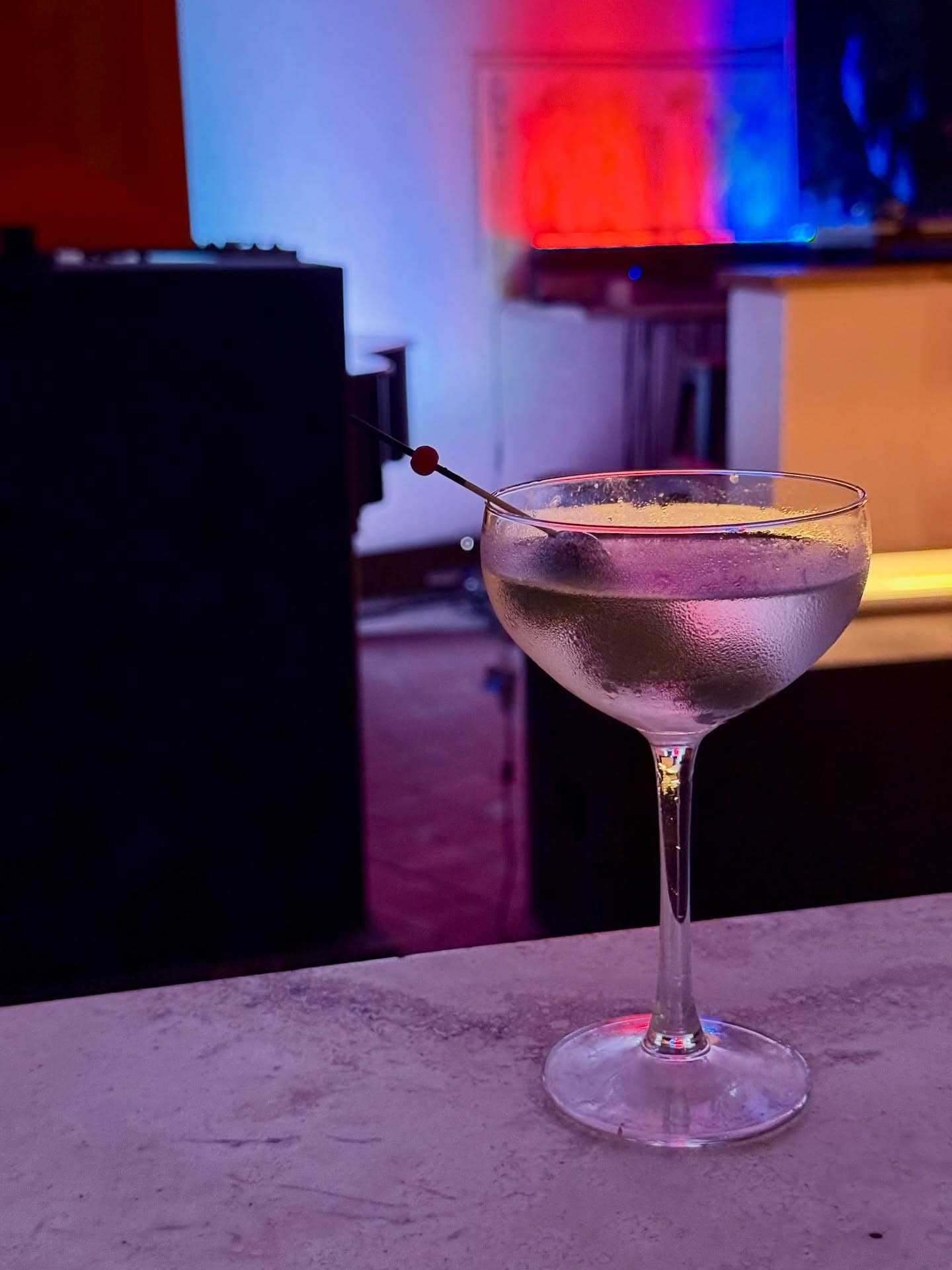 A martini sitting atop the bar at Poor Toms in Marrickville.