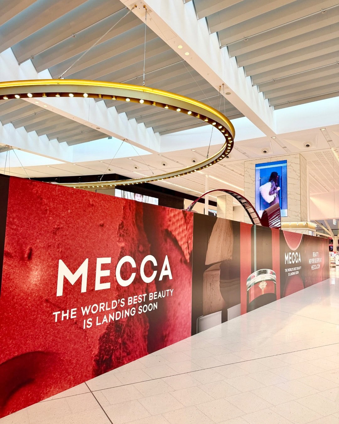 MECCA construction hoarding announcing new airport store at Sydney Airport T1
