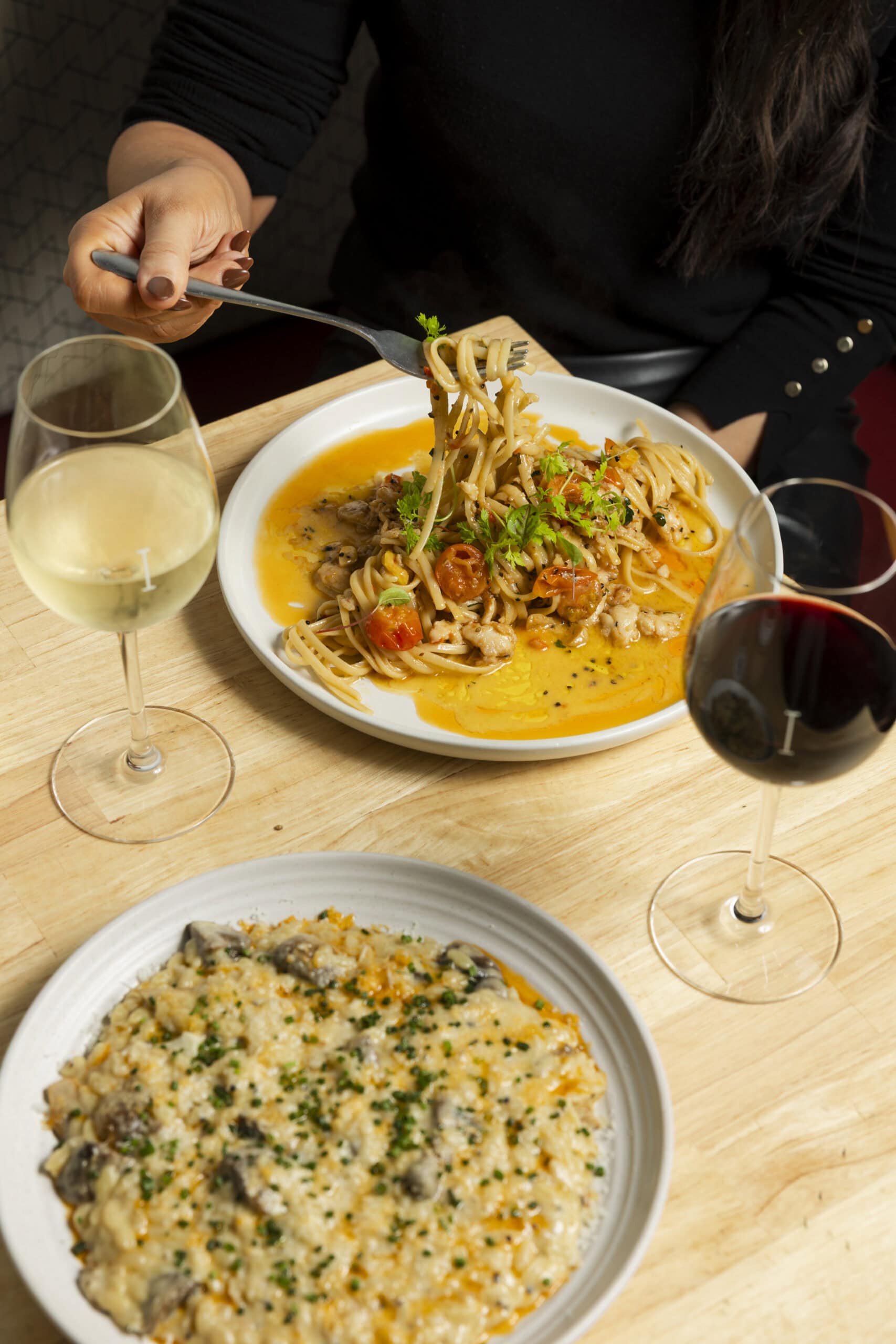 Two plates of pasta from Poppies in Brisbane.