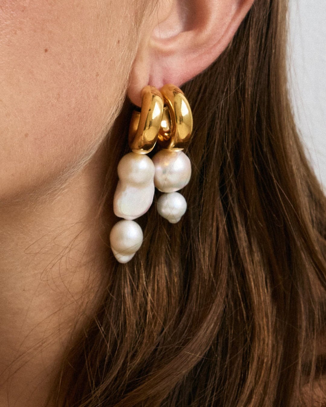 Pearl and gold earrings from Christie Nicolaides.