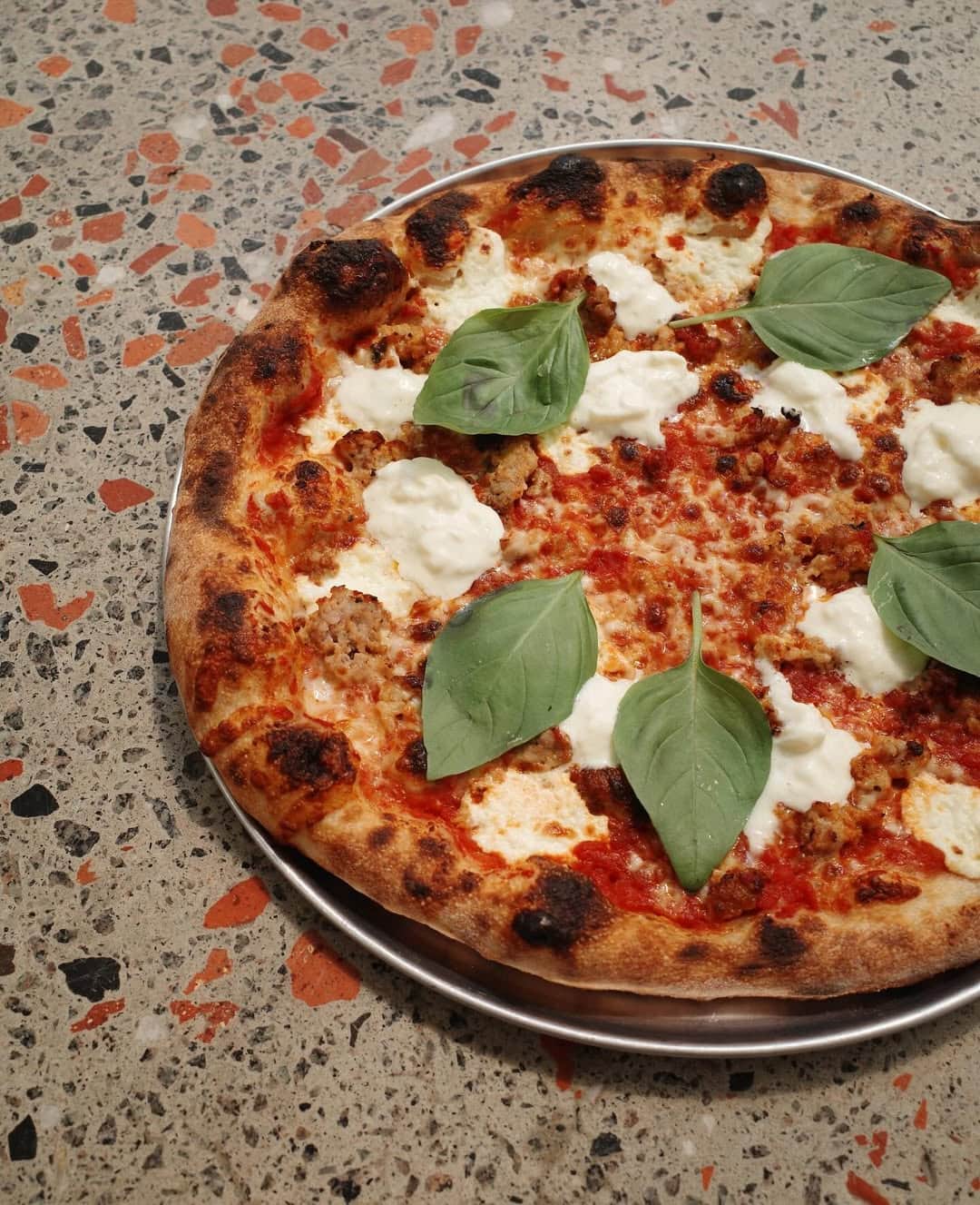 A close up of a pizza at Pizza Oltra at Poor Toms in Marrickville.