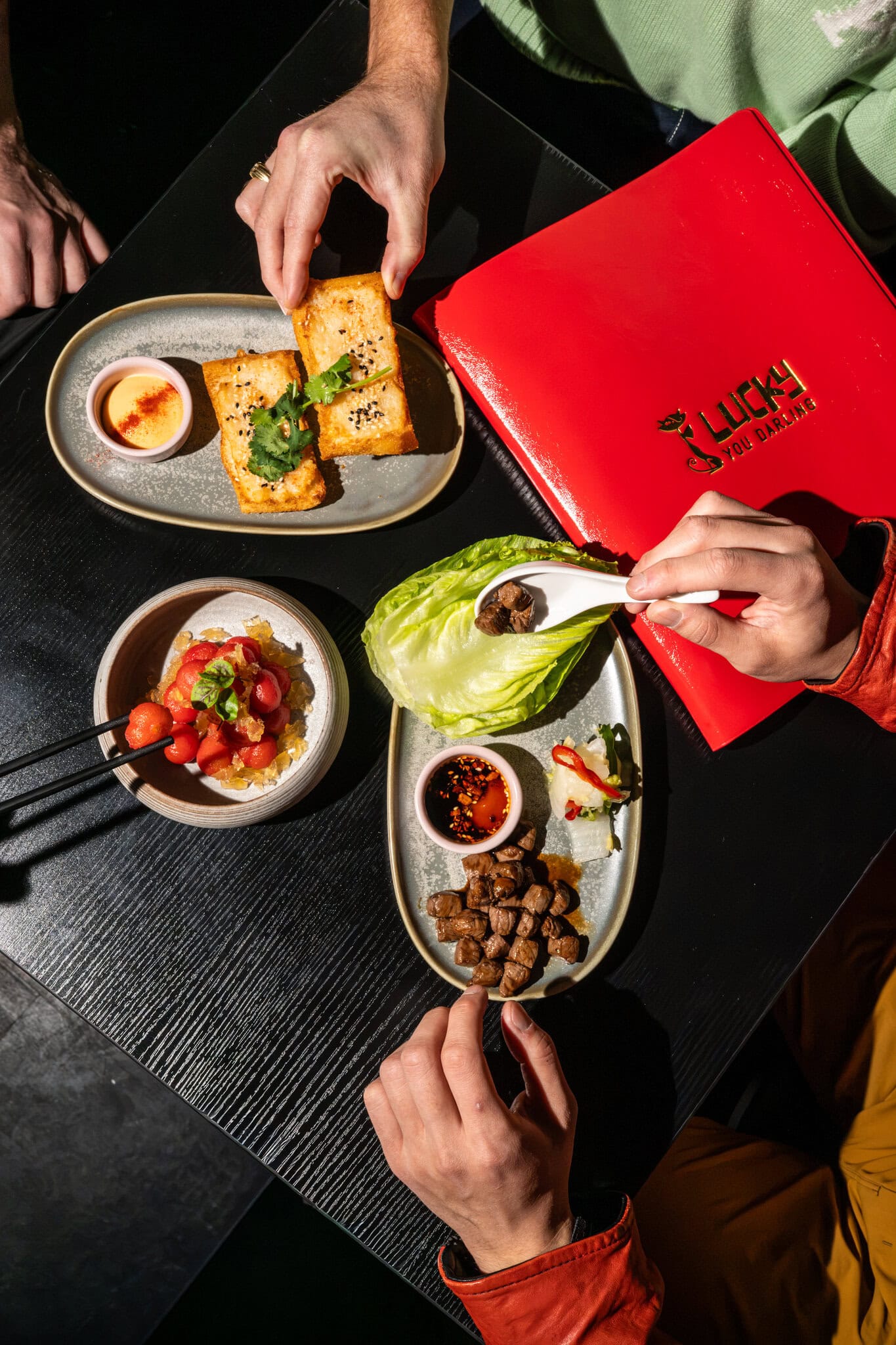 Prawn toast and Wagyu san choi bao with red menu Lucky You Darling Darlinghurst Sydney
