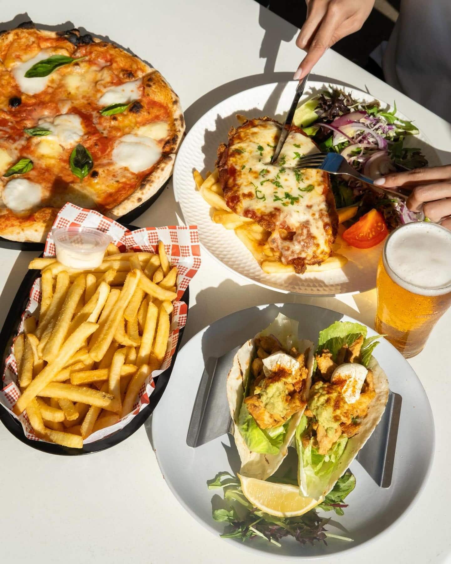 An array of pub-style dishes at The Diddy in North Sydney.