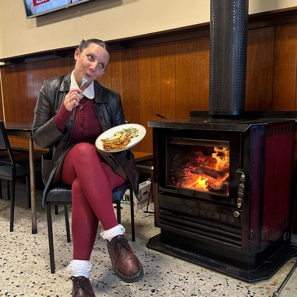railway hotel lasagne night melbourne girl sitting beside fire at the railway hotel fitzroy north