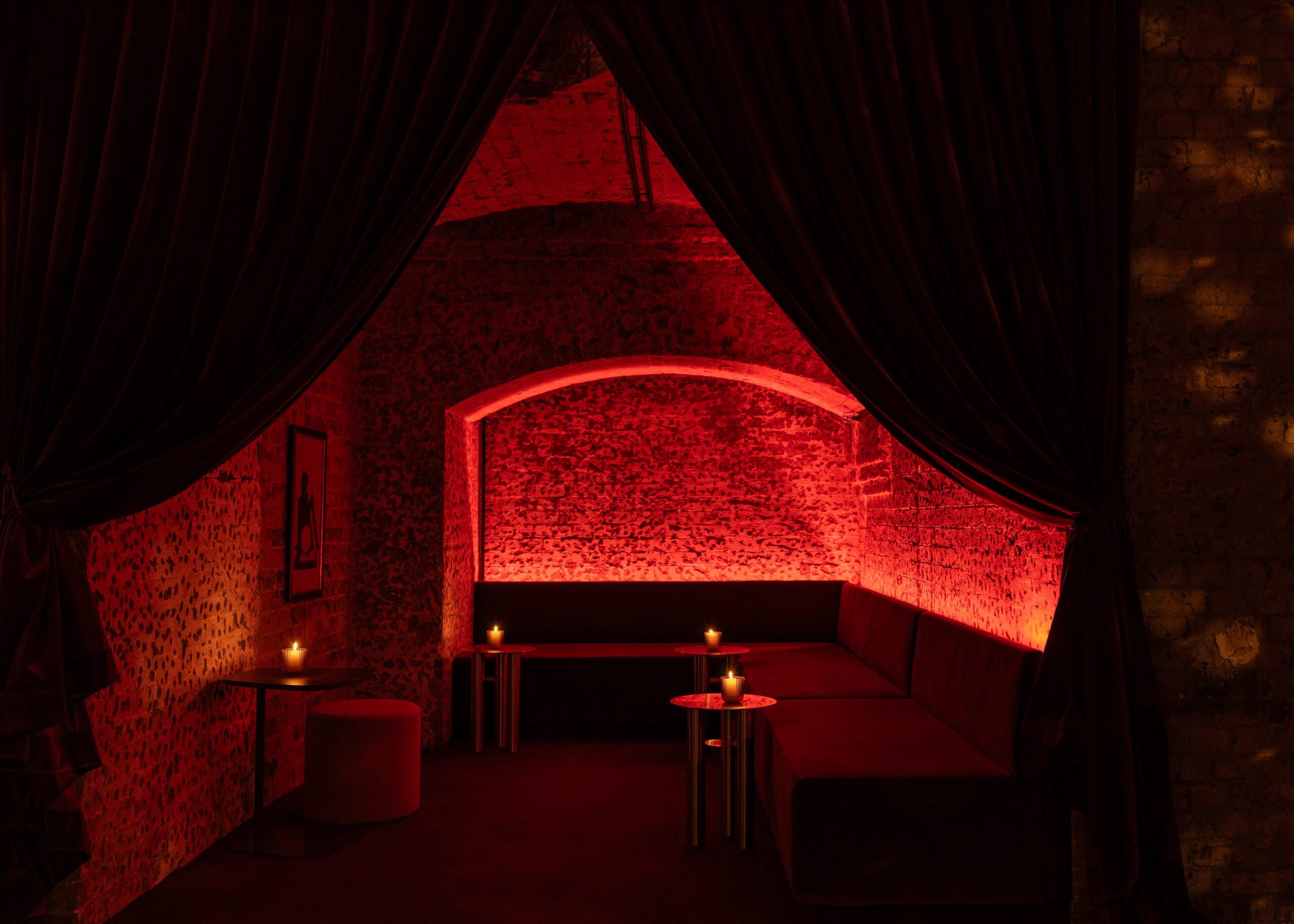Red-lit velvet lounge booth interior at Vespertine Sydney CBD