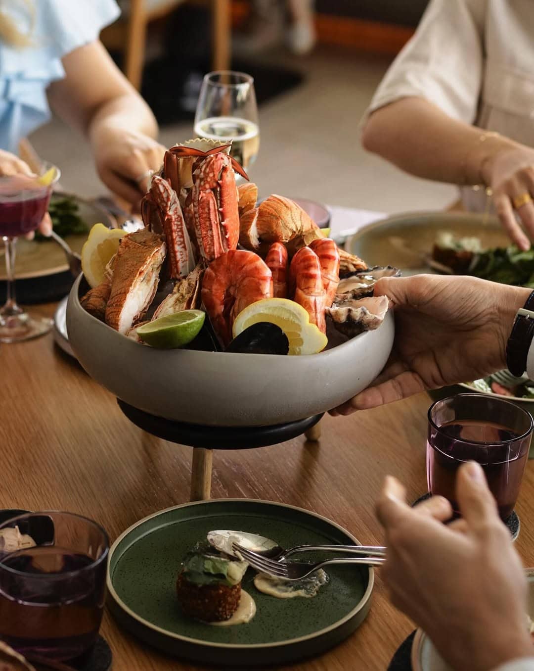 People tucking into a seafood platter for two at Woodcut in Barangaroo.